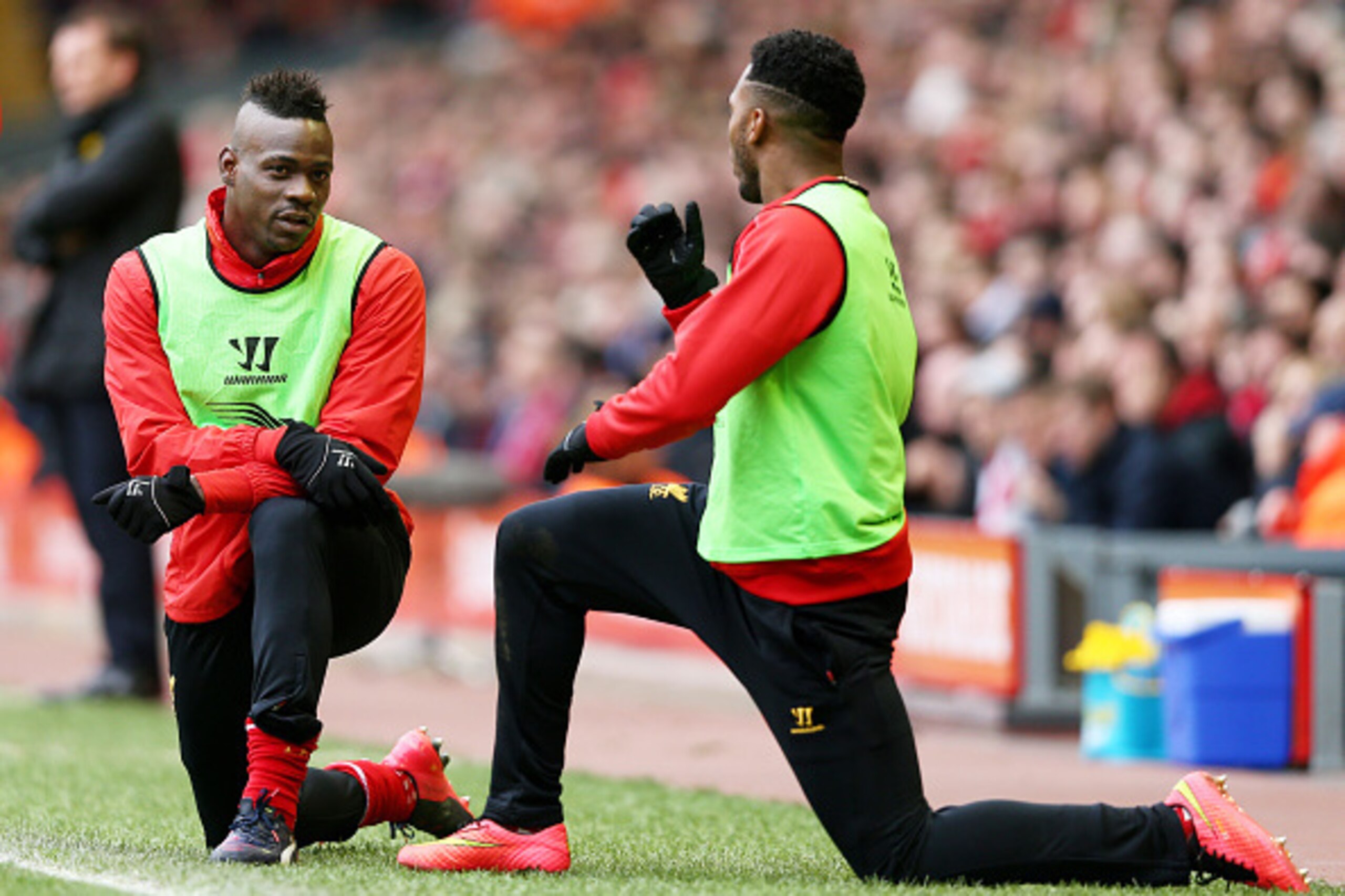 LIVERPOOL, ENGLAND - MARCH 01:  (L-R) Liverpool substitutes Mario Balotelli and Daniel Sturridge warm up during the Barclays Premier League match between Liverpool and Manchester City at Anfield on March 1, 2015 in Liverpool, England.  (Photo by Clive Bru