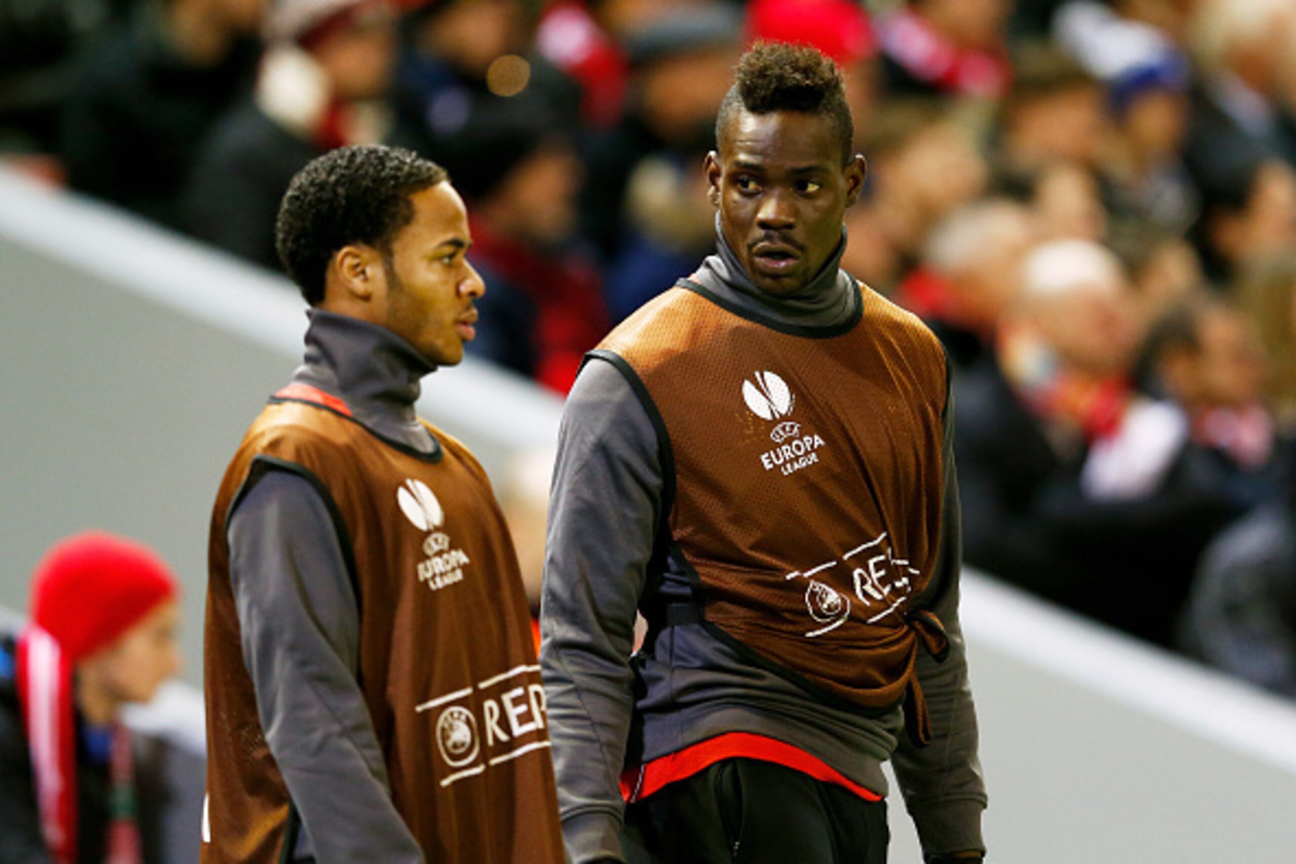 LIVERPOOL, ENGLAND - FEBRUARY 19:  Substitutes Raheem Sterling and Mario Balotelli of Liverpool warm up during the UEFA Europa League Round of 32 match between Liverpool FC and Besiktas JK at Anfield on February 19, 2015 in Liverpool, United Kingdom.  (Ph