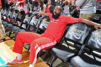 HOUSTON, TX - MARCH 19:  James Harden #13 of the Houston Rockets sits on the bench before the game against the Denver Nuggets on March 19, 2015 at the Toyota Center in Houston, Texas. NOTE TO USER: User expressly acknowledges and agrees that, by downloadi