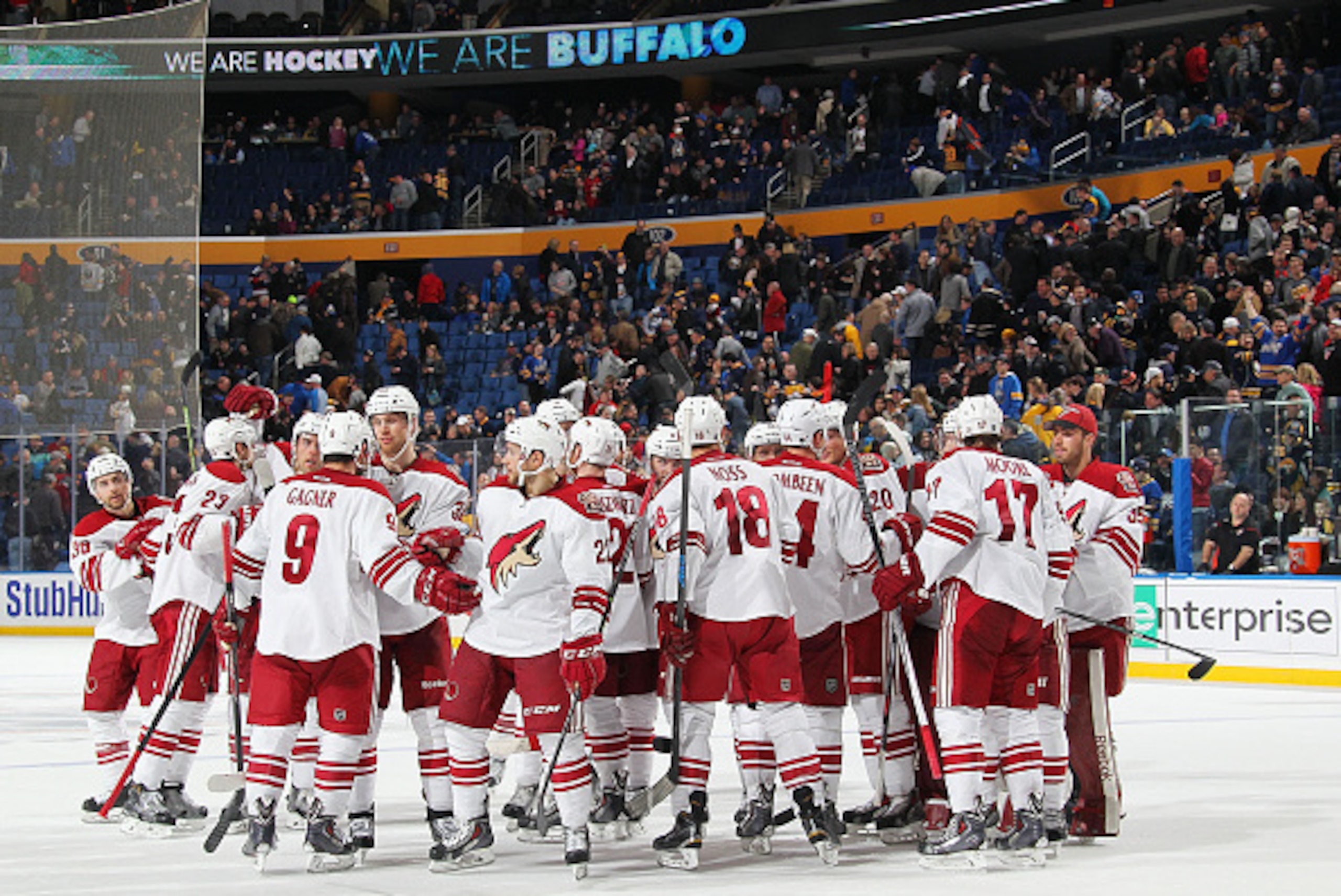 BUFFALO, NY - MARCH 26: Sam Gagner #9 of the Arizona Coyotes is mobbed by teammates after his game winning overtime goal against the Buffalo Sabres on March 26, 2015 at the First Niagara Center in Buffalo, New York. Arizona won, 4-3. (Photo by Bill Wipper