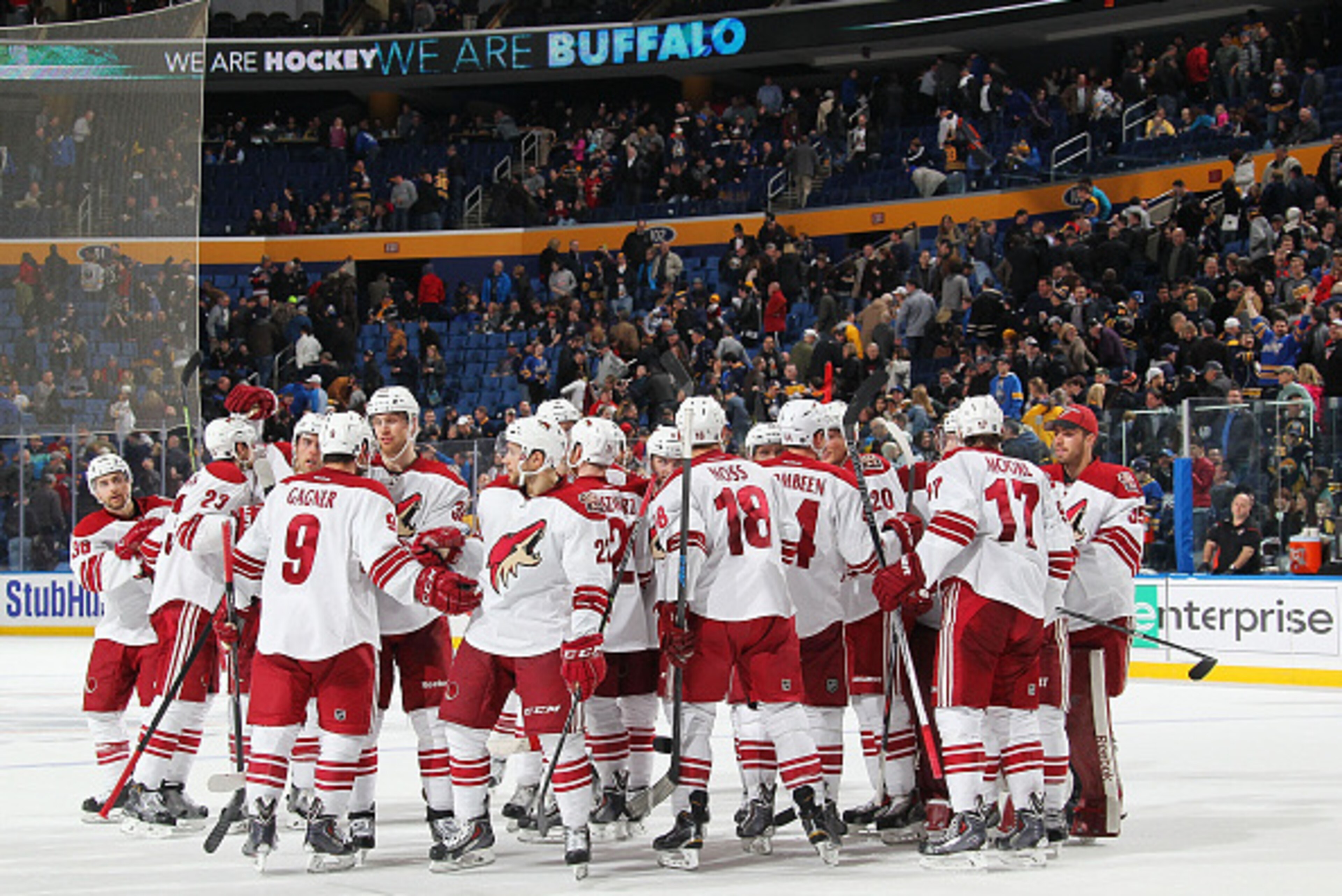 BUFFALO, NY - MARCH 26: Sam Gagner #9 of the Arizona Coyotes is mobbed by teammates after his game winning overtime goal against the Buffalo Sabres on March 26, 2015 at the First Niagara Center in Buffalo, New York. Arizona won, 4-3. (Photo by Bill Wipper