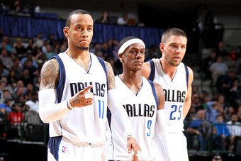DALLAS, TX - JANUARY 27: Monta Ellis #11, Rajon Rondo #9, and Chandler Parsons #25 of the Dallas Mavericks stand on the court during a game against the Memphis Grizzlies on January 27, 2015 at the American Airlines Center in Dallas, Texas. NOTE TO USER: U