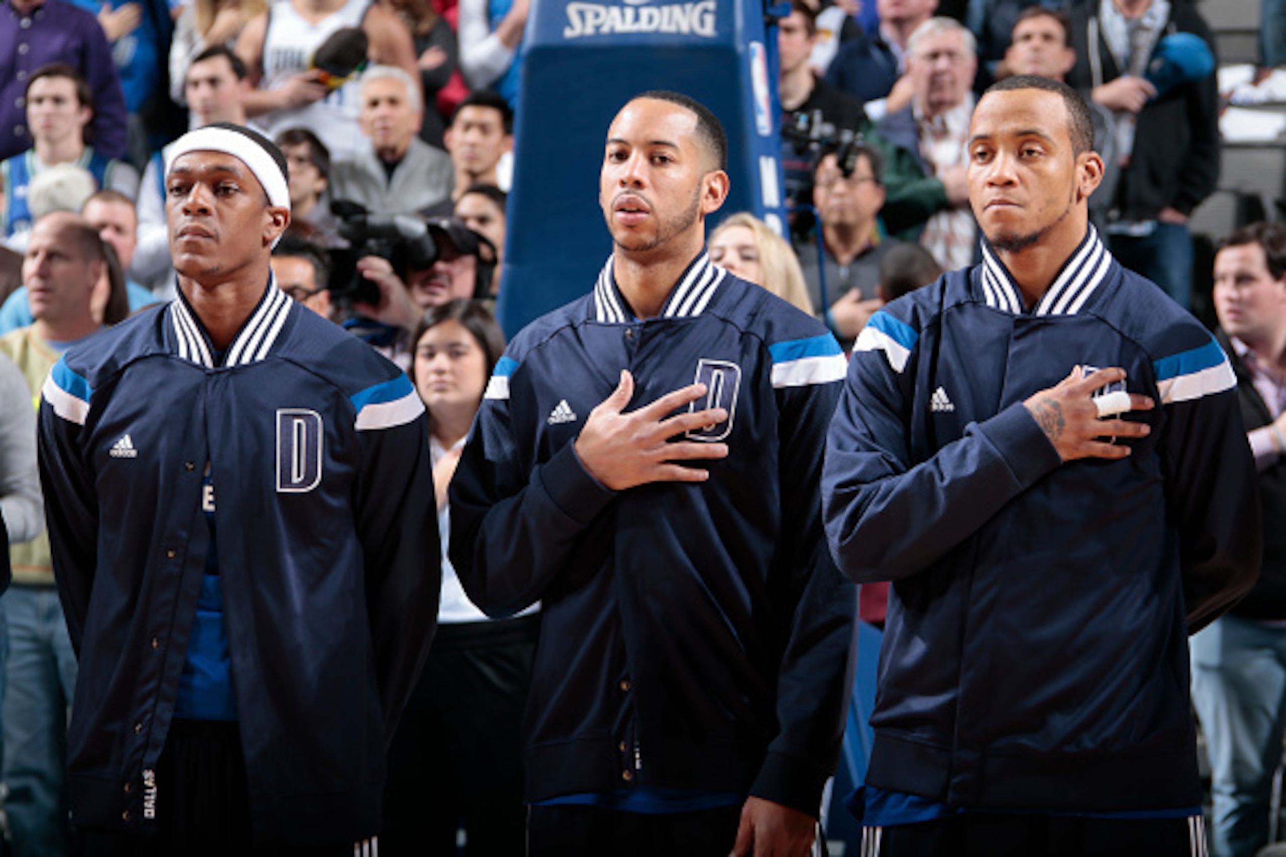 DALLAS, TX - DECEMBER 28: Rajon Rondo #9, Devin Harris #20 and Monta Ellis #11 of the Dallas Mavericks before a game against the Oklahoma City Thunder on December 28, 2014 at the American Airlines Center in Dallas, Texas. NOTE TO USER: User expressly ackn