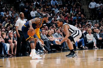SAN ANTONIO - MARCH 12: LeBron James #23 of the Cleveland Cavaliers handles the ball against Kawhi Leonard #2 of the San Antonio Spurs at the AT&T Center on March 12, 2015 in San Antonio, Texas. NOTE TO USER: User expressly acknowledges and agrees that, b