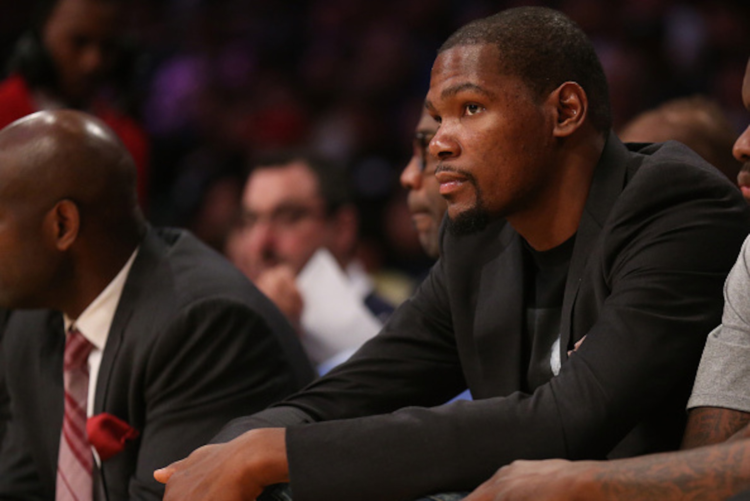 LOS ANGELES, CA - MARCH 01:  Injured player Kevin Durant of the Oklahoma City Thunder looks on from the bench during the game against the Los Angeles Lakers at Staples Center on March 1, 2015 in Los Angeles, California.  The Thunder won 108-101.   NOTE TO