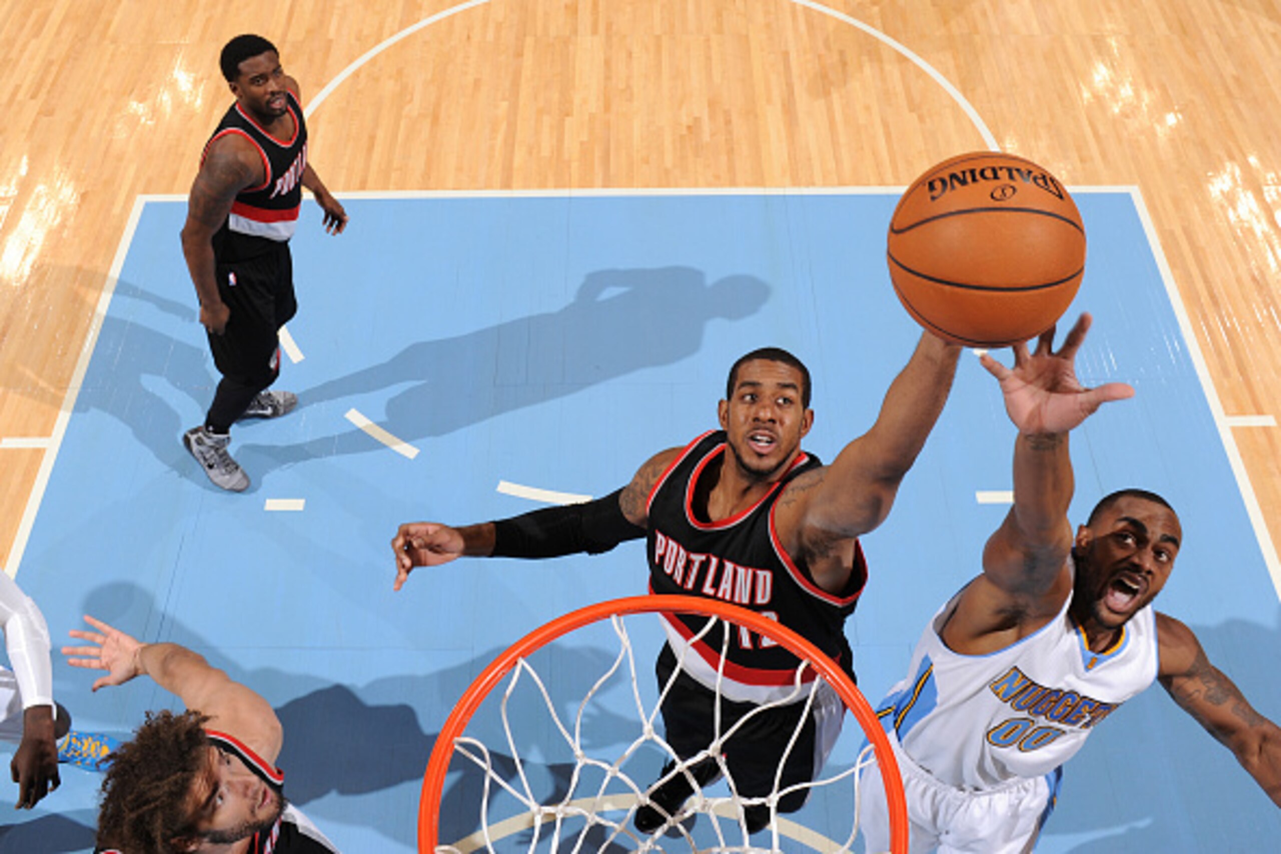 DENVER, CO - NOVEMBER 12:  LaMarcus Aldridge #12 of the Portland Trail Blazers goes up for a rebound against Darrell Arthur #00 of the Denver Nuggets during the game on November 12, 2014 at the Pepsi Center in Denver, Colorado. NOTE TO USER: User expressl