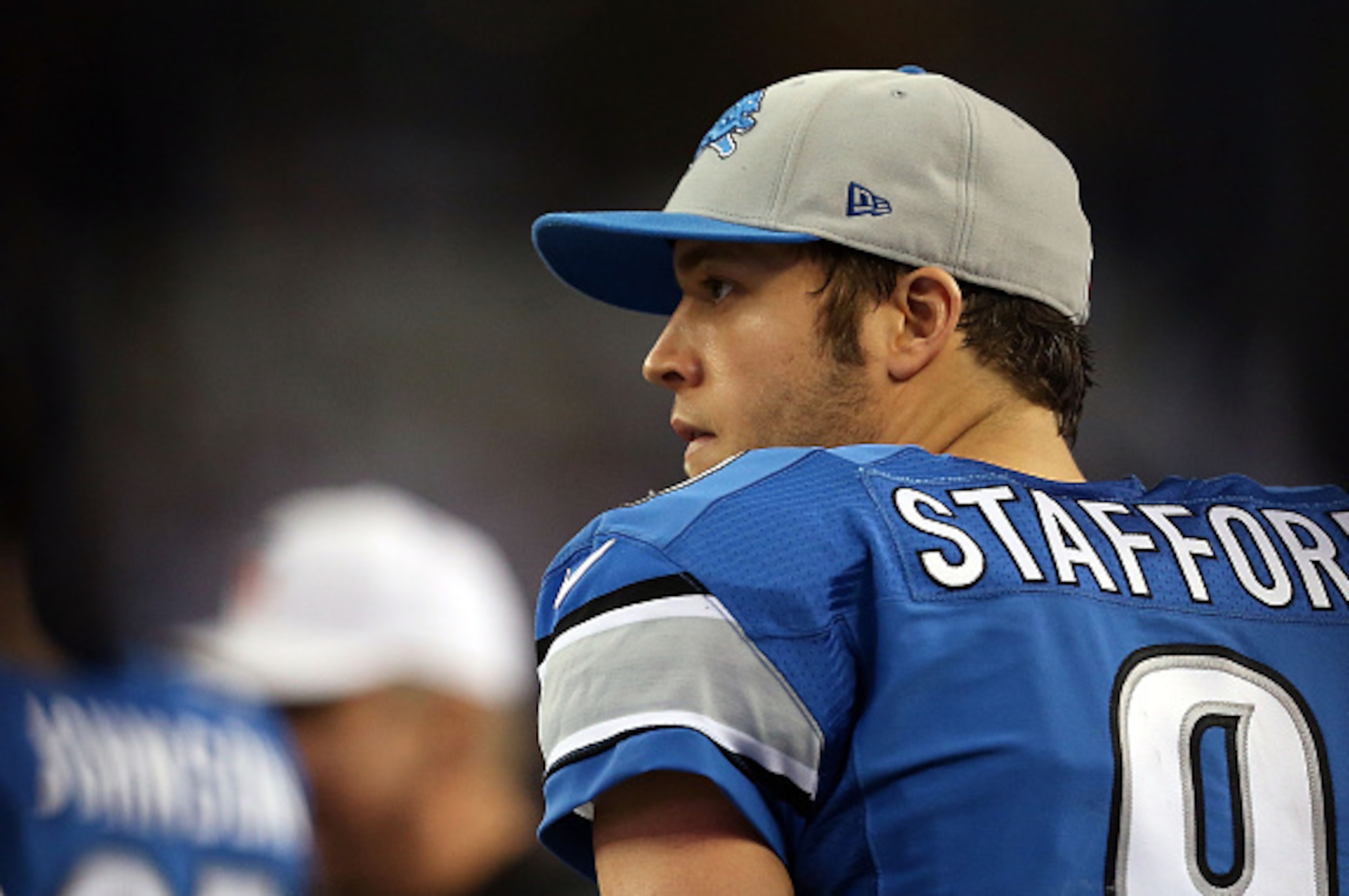 ARLINGTON, TX - JANUARY 04:  Matthew Stafford #9 of the Detroit Lions watches from the sideline during the second half of their NFC Wild Card Playoff game against the Dallas Cowboys at AT&T Stadium on January 4, 2015 in Arlington, Texas.  (Photo by Sarah 