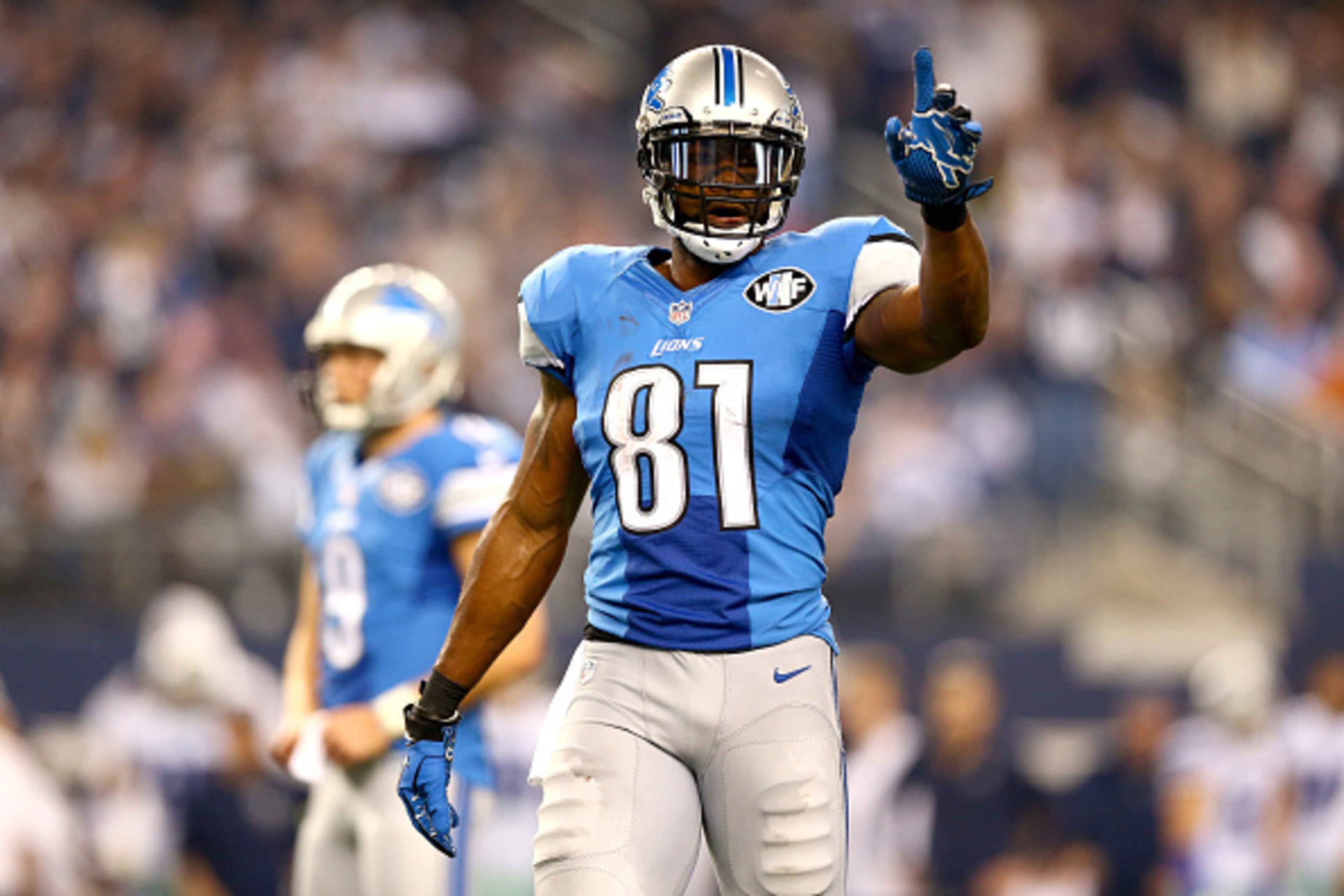 ARLINGTON, TX - JANUARY 04:  Wide receiver Calvin Johnson #81 of the Detroit Lions holds up one finger in the second half while taking on the Dallas Cowboys during the NFC Wildcard Playoff Game at AT&T Stadium on January 4, 2015 in Arlington, Texas.  (Pho