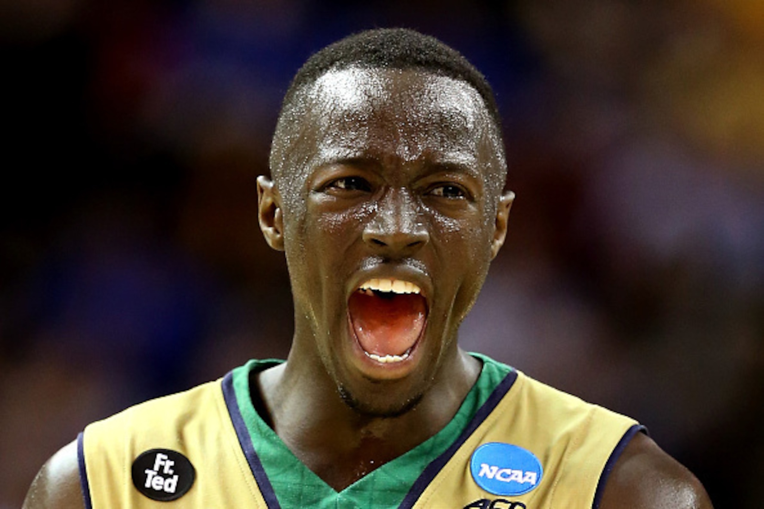 CLEVELAND, OH - MARCH 26:  Jerian Grant #22 of the Notre Dame Fighting Irish celebrates after a play in the second half against the Wichita State Shockers during the Midwest Regional semifinal of the 2015 NCAA Men's Basketball Tournament at Quicken Loans 