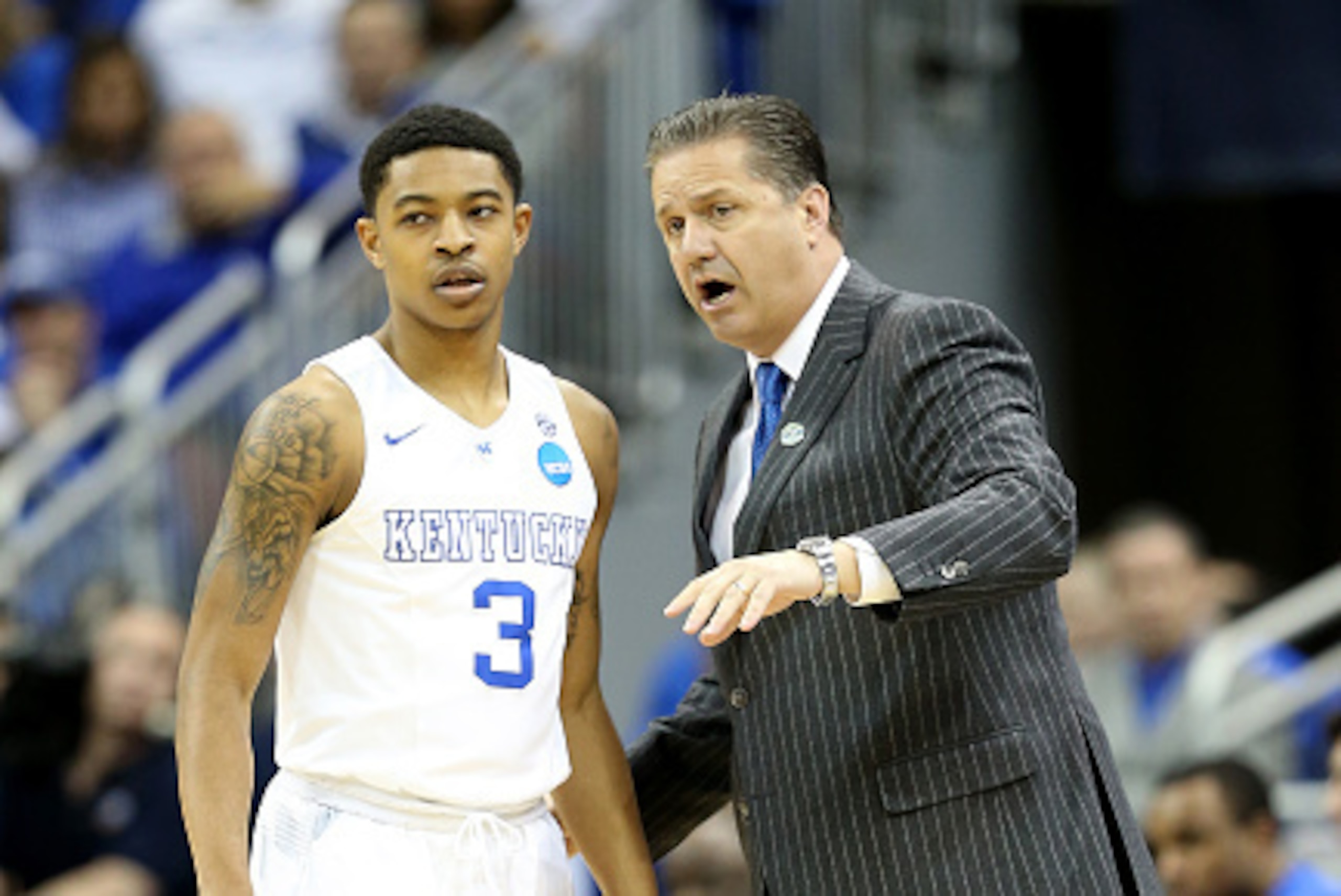 LOUISVILLE, KY - MARCH 21:  Tyler Ulis #3 of the Kentucky Wildcats talks to his head coach John Calipari against the Cincinnati Bearcats during the third round of the 2015 NCAA Men's Basketball Tournament at KFC YUM! Center on March 21, 2015 in Louisville