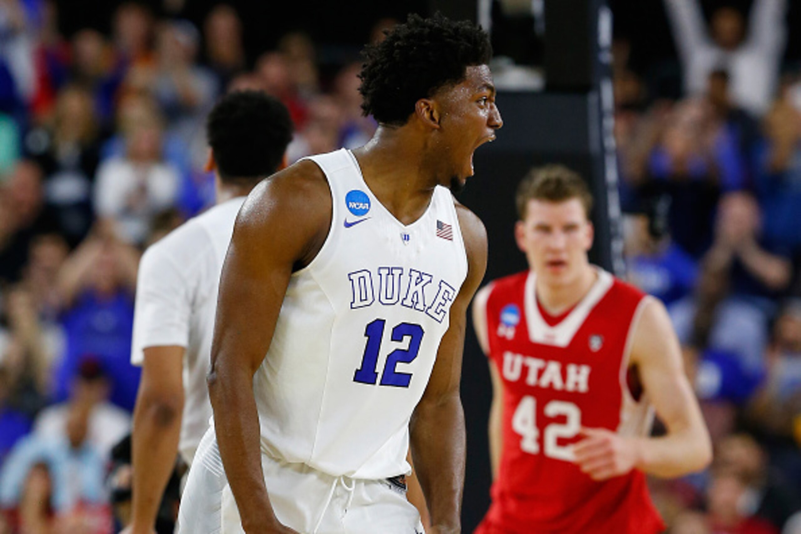 HOUSTON, TX - MARCH 27:  Justise Winslow #12 of the Duke Blue Devils reacts against the Utah Utes during a South Regional Semifinal game of the 2015 NCAA Men's Basketball Tournament at NRG Stadium on March 27, 2015 in Houston, Texas.  (Photo by Tom Pennin