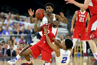 HOUSTON, TX - MARCH 27:  Delon Wright #55 of the Utah Utes and Quinn Cook #2 and Justise Winslow #12 of the Duke Blue Devils battle for a loose ball during a South Regional Semifinal game of the 2015 NCAA Men's Basketball Tournament at NRG Stadium on Marc