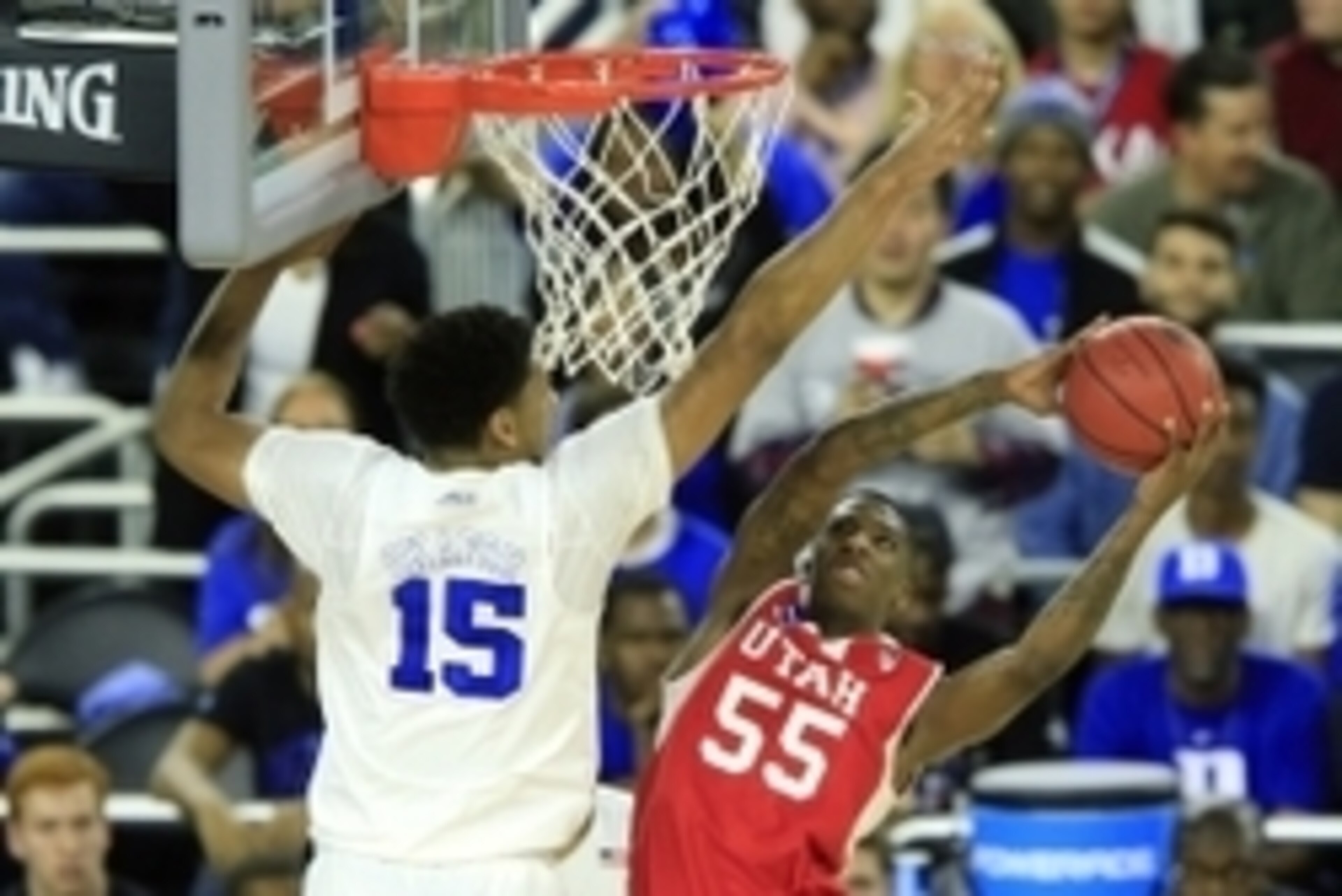 Mar 27, 2015; Houston, TX, USA; Utah Utes guard Delon Wright (55) shoots against Duke Blue Devils center Jahlil Okafor (15) during the first half in the semifinals of the south regional of the 2015 NCAA Tournament at Reliant Stadium. Mandatory Credit: Kev