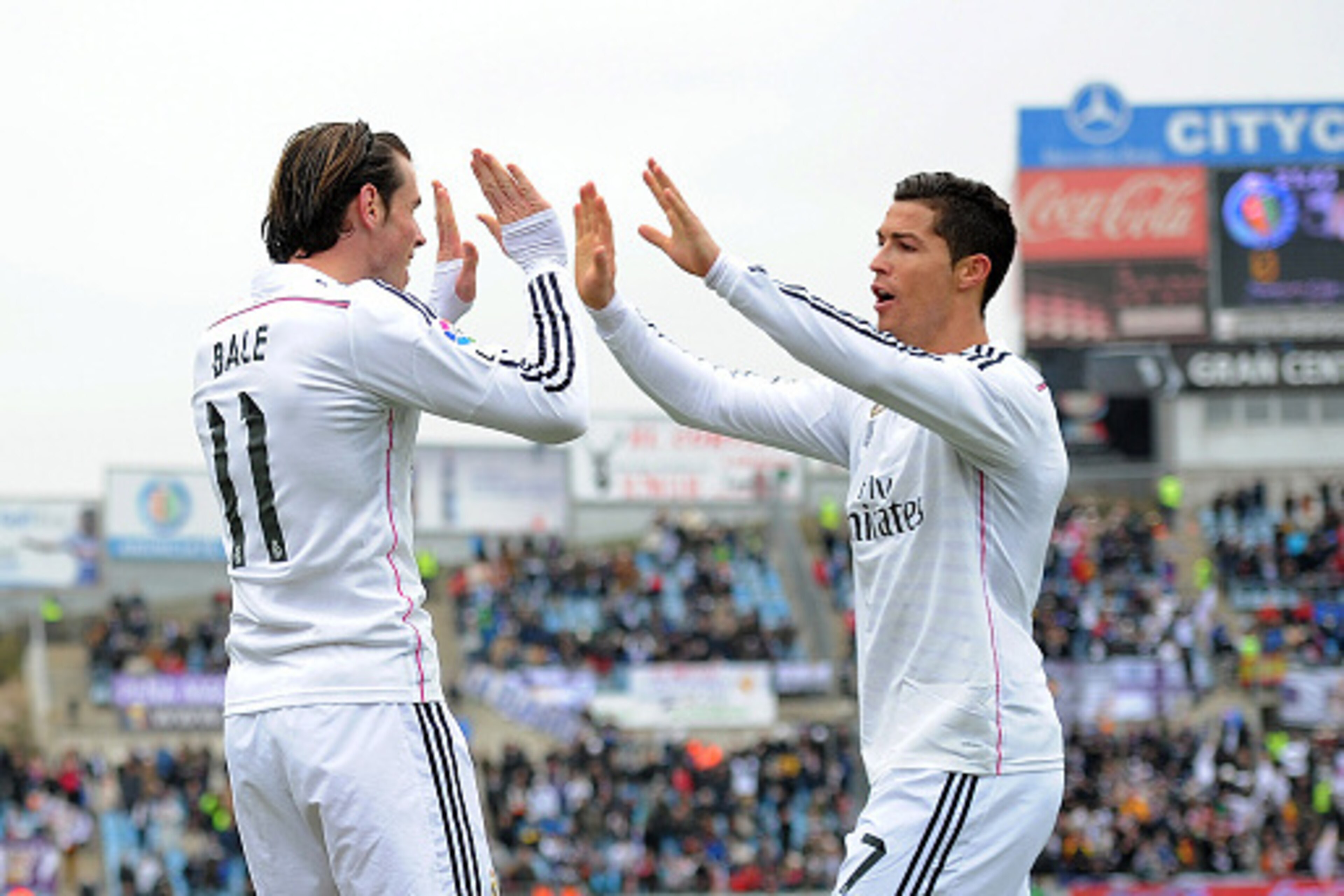 GETAFE, SPAIN - JANUARY 18:  Gareth Bale of Real Madrid celebrates with Cristiano Ronaldo after scoring his team's 2nd goal during the La Liga match between Getafe CF and Real Madrid CF at Coliseum Alfonso Perez stadium on January 18, 2015 in Getafe, Spai