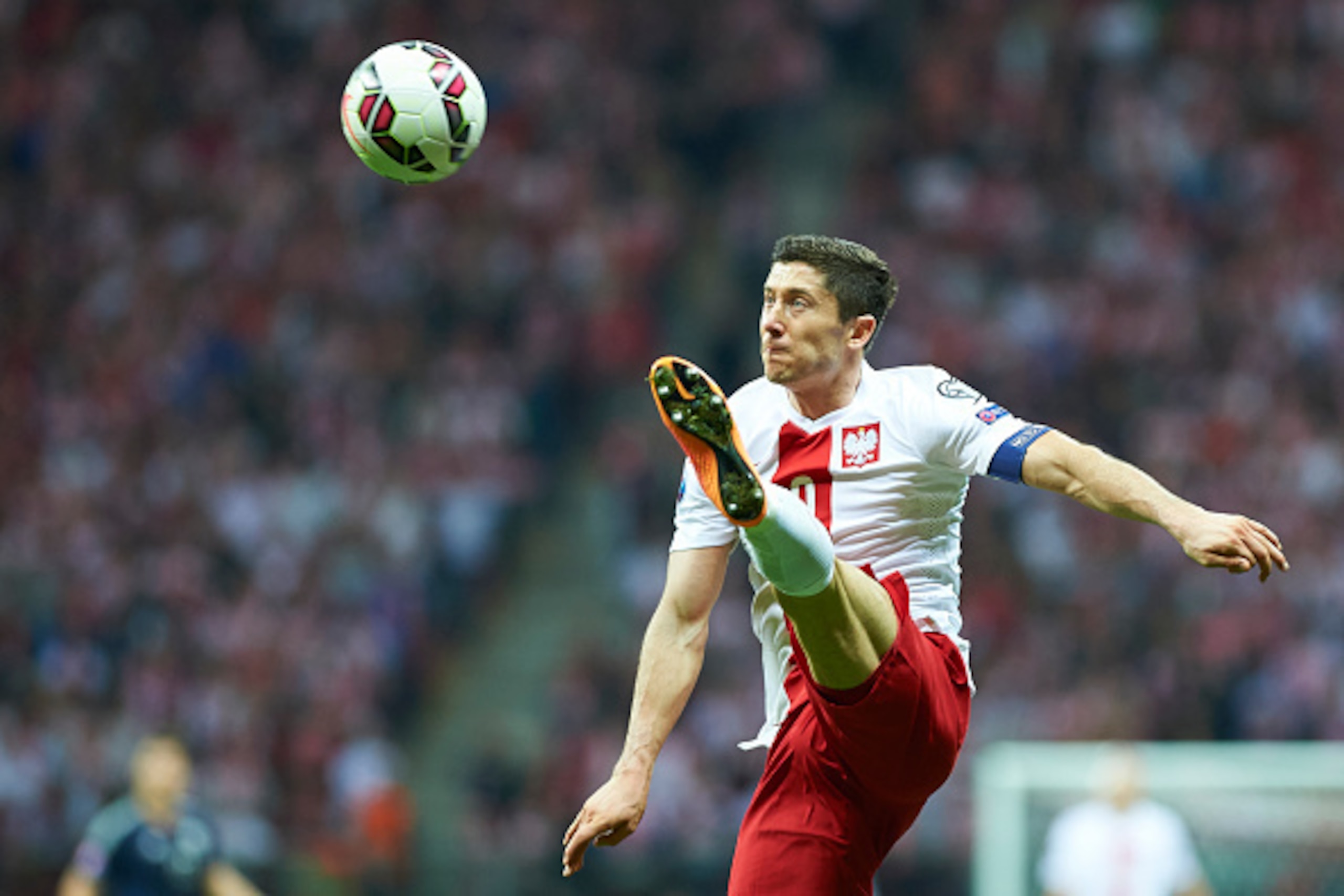 WARSAW, POLAND - OCTOBER 14: Poland's Robert Lewandowski controls the ball during the UEFA EURO 2016 qualifying match between Poland and Scotland at the National Stadium on October 14, 2014 in Warsaw, Poland. (Photo by Adam Nurkiewicz/Getty Images)
