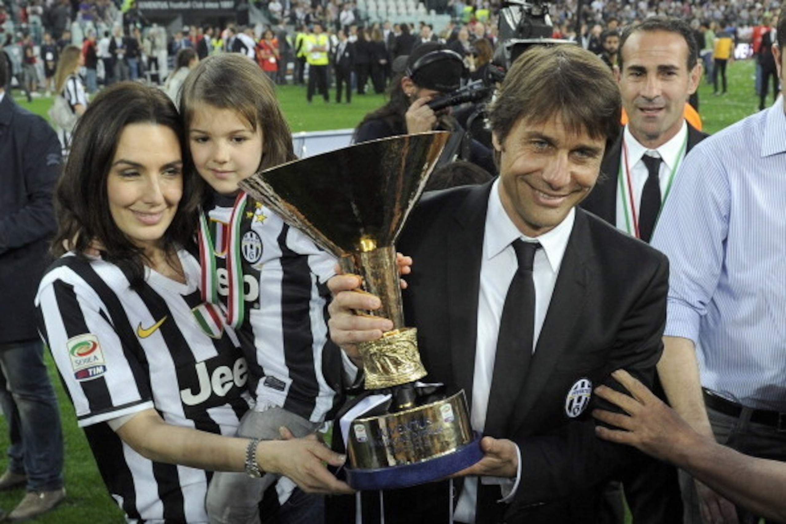 TURIN, ITALY - MAY 11:  Antonio Conte of Juventus FC and his family celebrate with the Serie A trophy after the Serie A match between Juventus and Cagliari Calcio at Juventus Arena on May 11, 2013 in Turin, Italy.  (Photo by Claudio Villa/Getty Images)