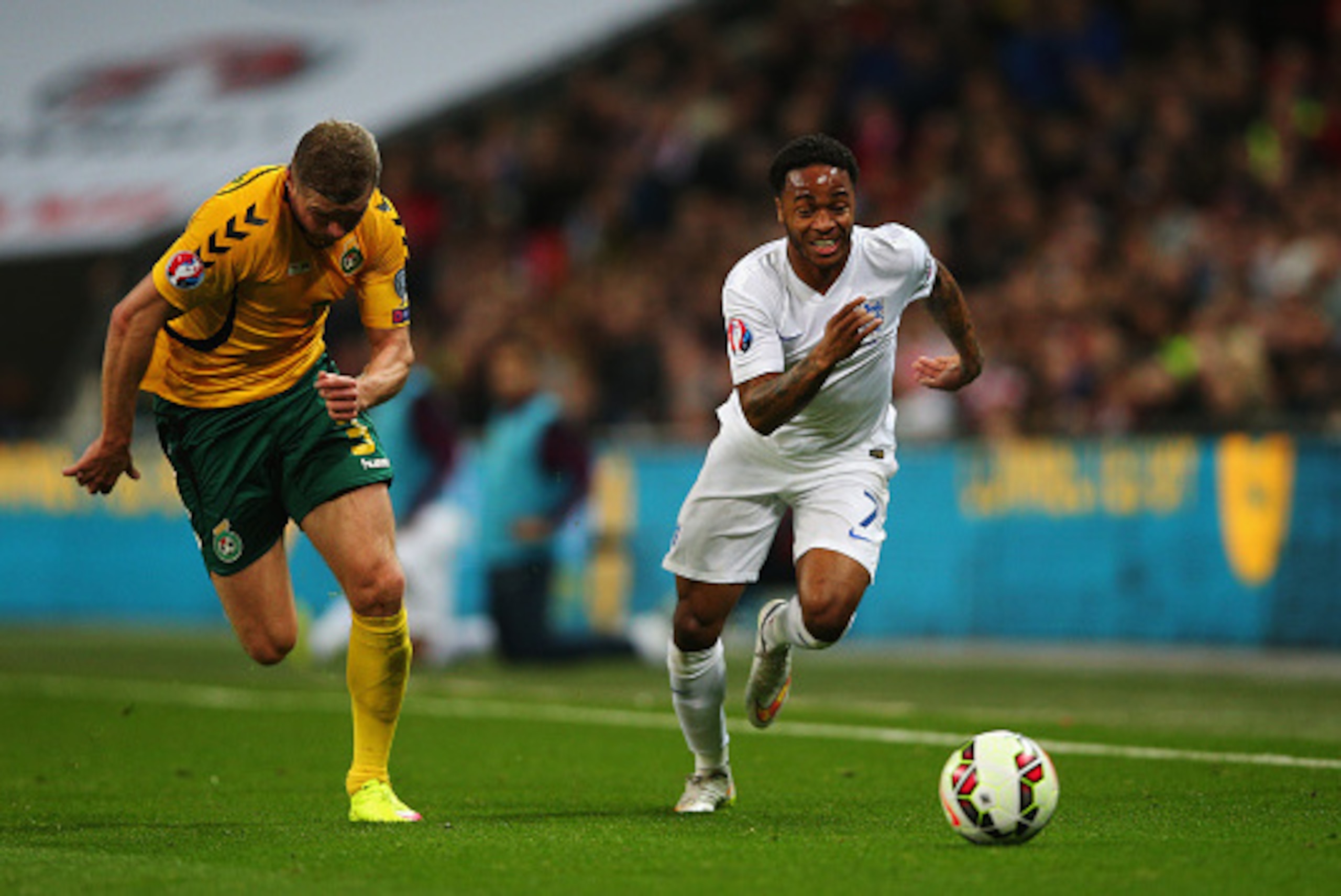 LONDON, ENGLAND - MARCH 27:  Raheem Sterling of England (R) out paces Georgas Freidgeimas of Lithuania during the EURO 2016 Qualifier match between England and Lithuania at Wembley Stadium on March 27, 2015 in London, England.  (Photo by Paul Gilham/Getty