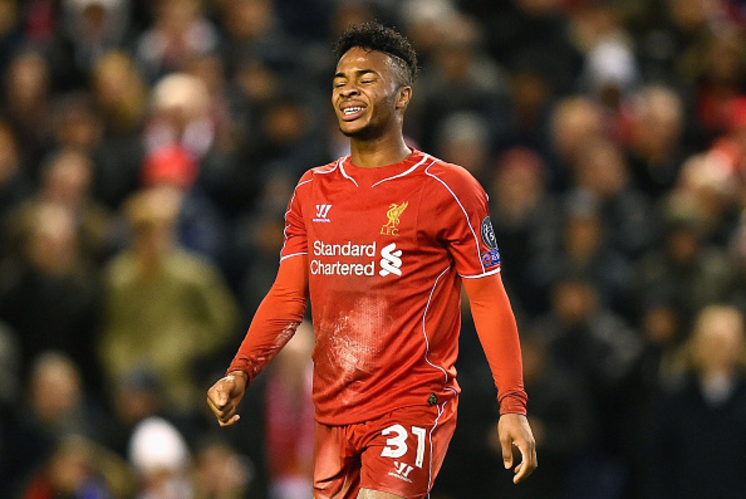 LIVERPOOL, ENGLAND - DECEMBER 09:  A dejected Raheem Sterling of Liverpool reacts following his team's 1-1 draw and exit from the competition during the UEFA Champions League group B match between Liverpool and FC Basel 1893 at Anfield on December 9, 2014