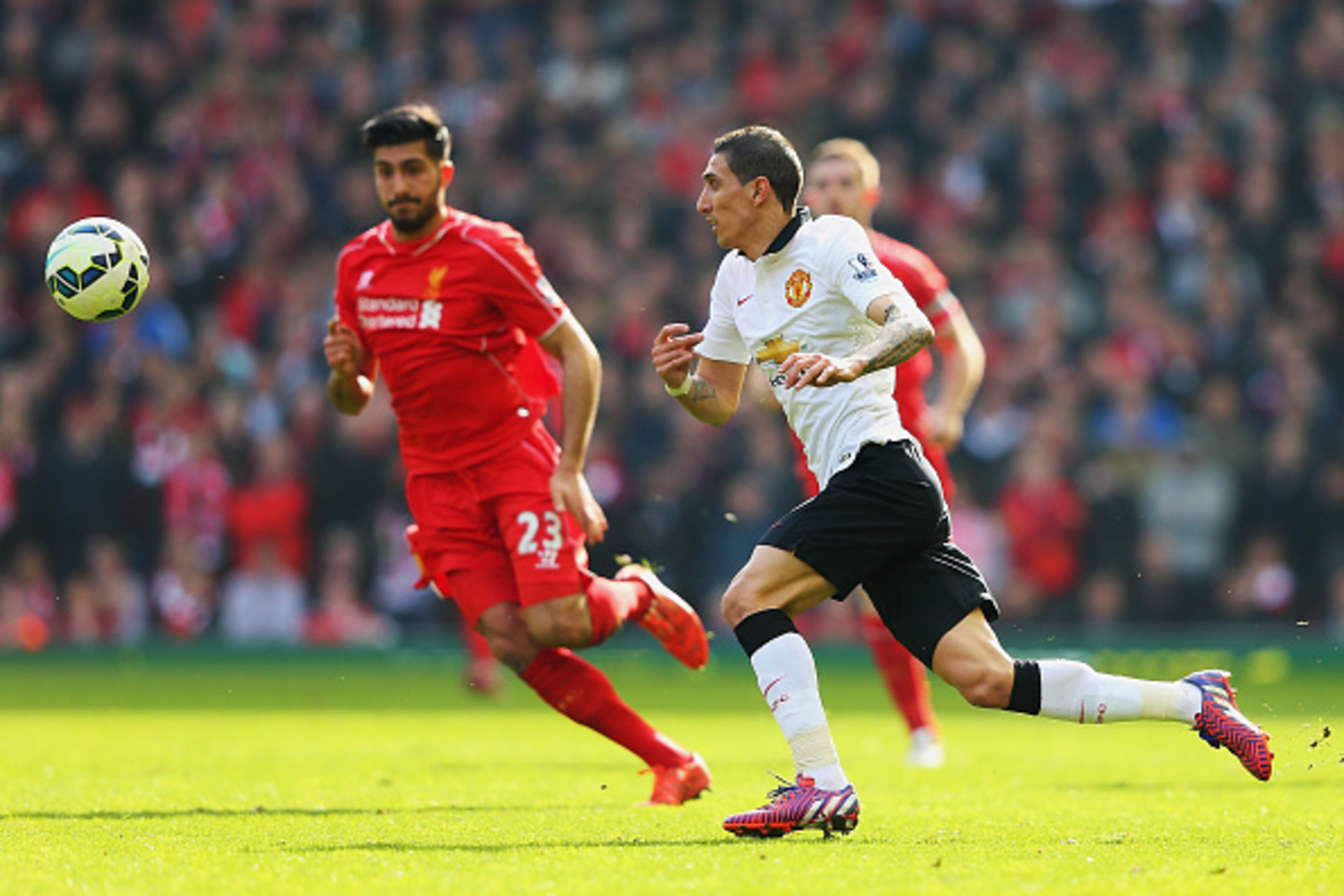 LIVERPOOL, ENGLAND - MARCH 22: Angel Di Maria of Manchester United challenges for the ball with Emre Can of Liverpool during the Barclays Premier League match between Liverpool and Manchester United at Anfield on March 22, 2015 in Liverpool, England. (P LIVERPOOL, ENGLAND - MARCH 22: Angel Di Maria of Manchester United challenges for the ball with Emre Can of Liverpool during the Barclays Premier League match between Liverpool and Manchester United at Anfield on March 22, 2015 in Liverpool, England. (P