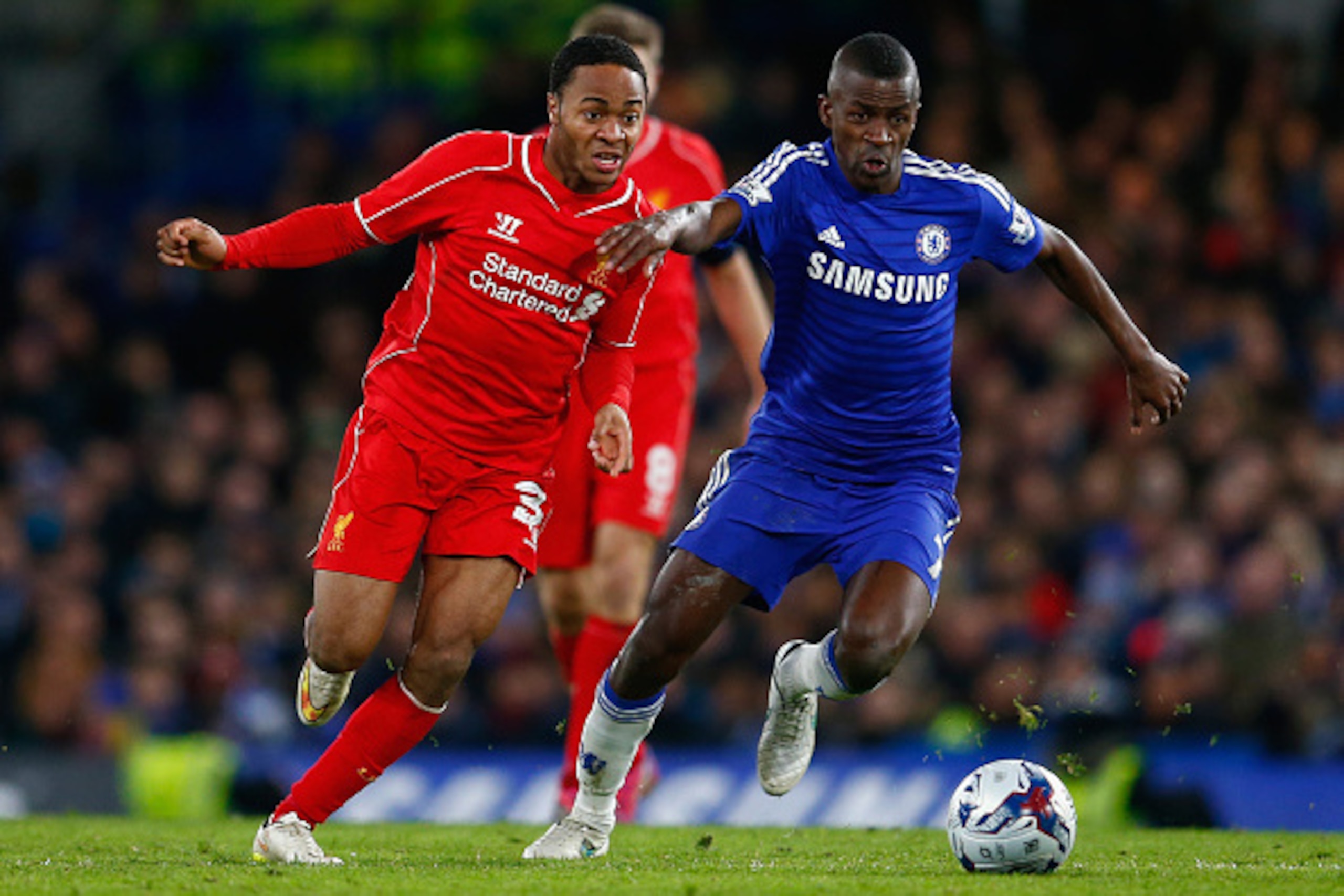 LONDON, ENGLAND - JANUARY 27:  Raheem Sterling of Liverpool and Ramires of Chelsea battle for the ball during the Capital One Cup Semi-Final second leg between Chelsea and Liverpool at Stamford Bridge on January 27, 2015 in London, England.  (Photo by Jul