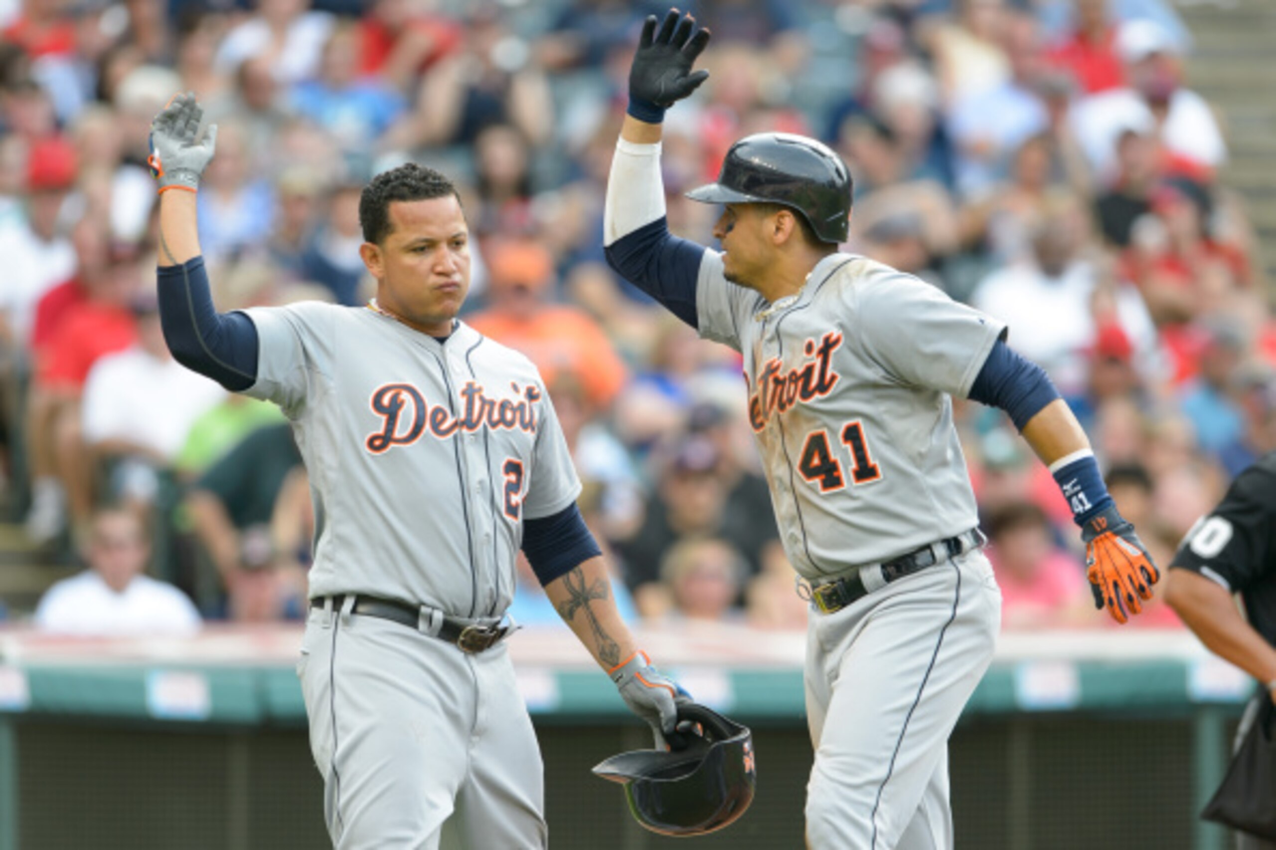 CLEVELAND, OH - SEPTEMBER 1: Miguel Cabrera #24 celebrates with Victor Martinez #41 of the Detroit Tigers after both scored on a home run hit by Martinez during the third inning against the Cleveland Indians a Progressive Field on September 1, 2014 in Cle