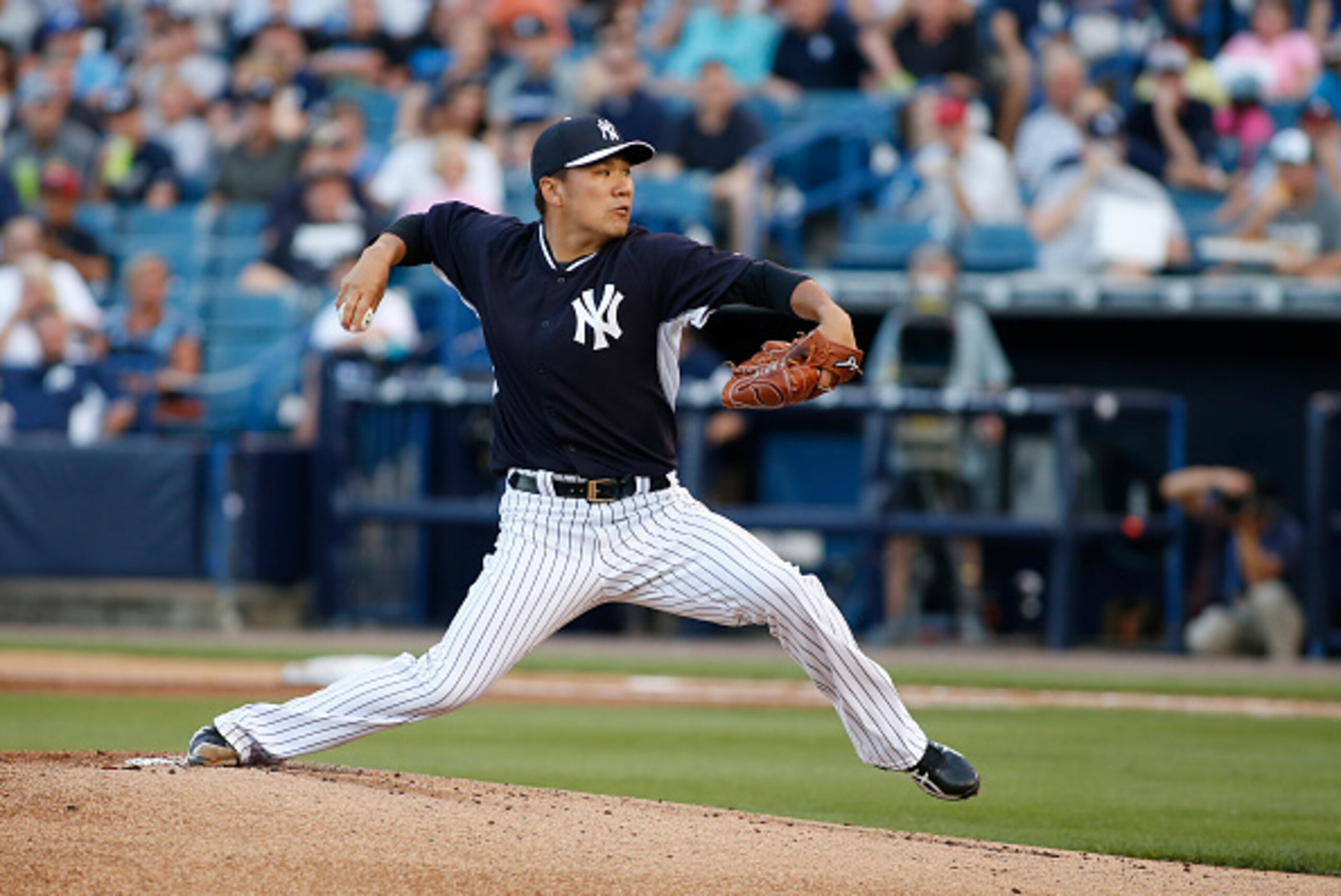 TAMPA, FL - MARCH 12:  Pitcher Masahiro Tanaka #19 of the New York Yankees pitches during the first inning of a spring training game against the Atlanta Braves on March 12, 2015 at George M. Steinbrenner Field in Tampa, Florida.  (Photo by Brian Blanco/Ge