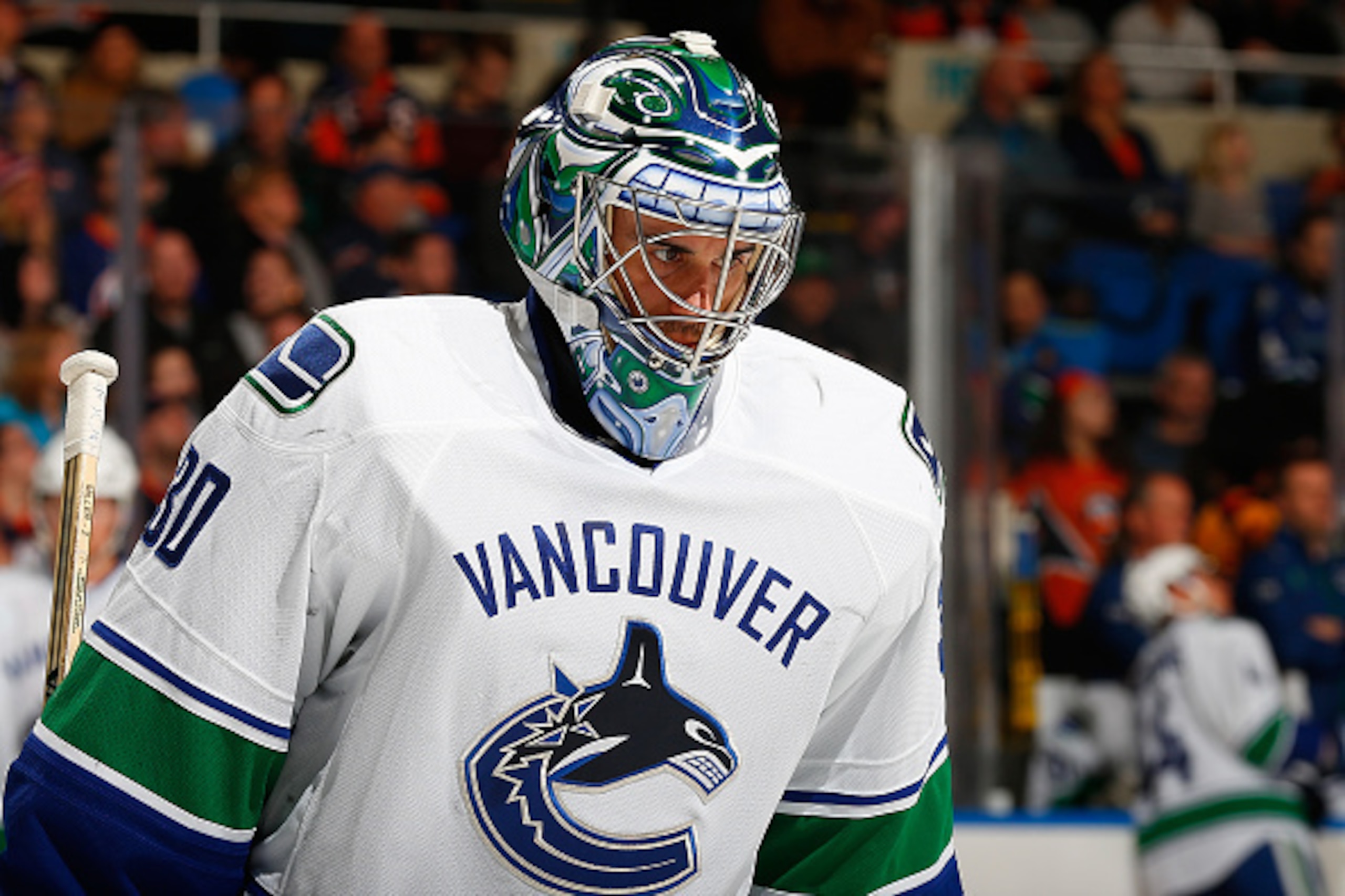 UNIONDALE, NY - FEBRUARY 22:  Ryan Miller #30 of the Vancouver Canucks skates against the New York Islanders  at Nassau Veterans Memorial Coliseum on February 22, 2015 in Uniondale, New York. The Canucks defeated the Islanders 4-0.  (Photo by Mike Stobe/N