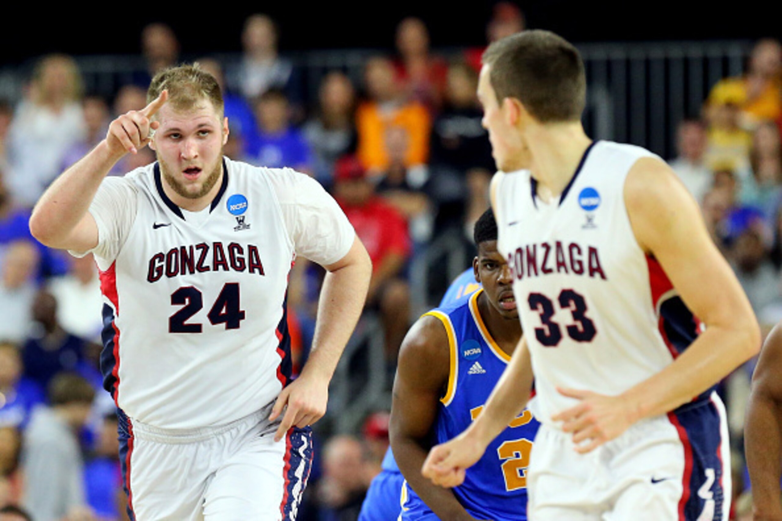 HOUSTON, TX - MARCH 27:  Przemek Karnowski #24 celebrates with Kyle Wiltjer #33 of the Gonzaga Bulldogs against the UCLA Bruins during a South Regional Semifinal game of the 2015 NCAA Men's Basketball Tournament at NRG Stadium on March 27, 2015 in Houston