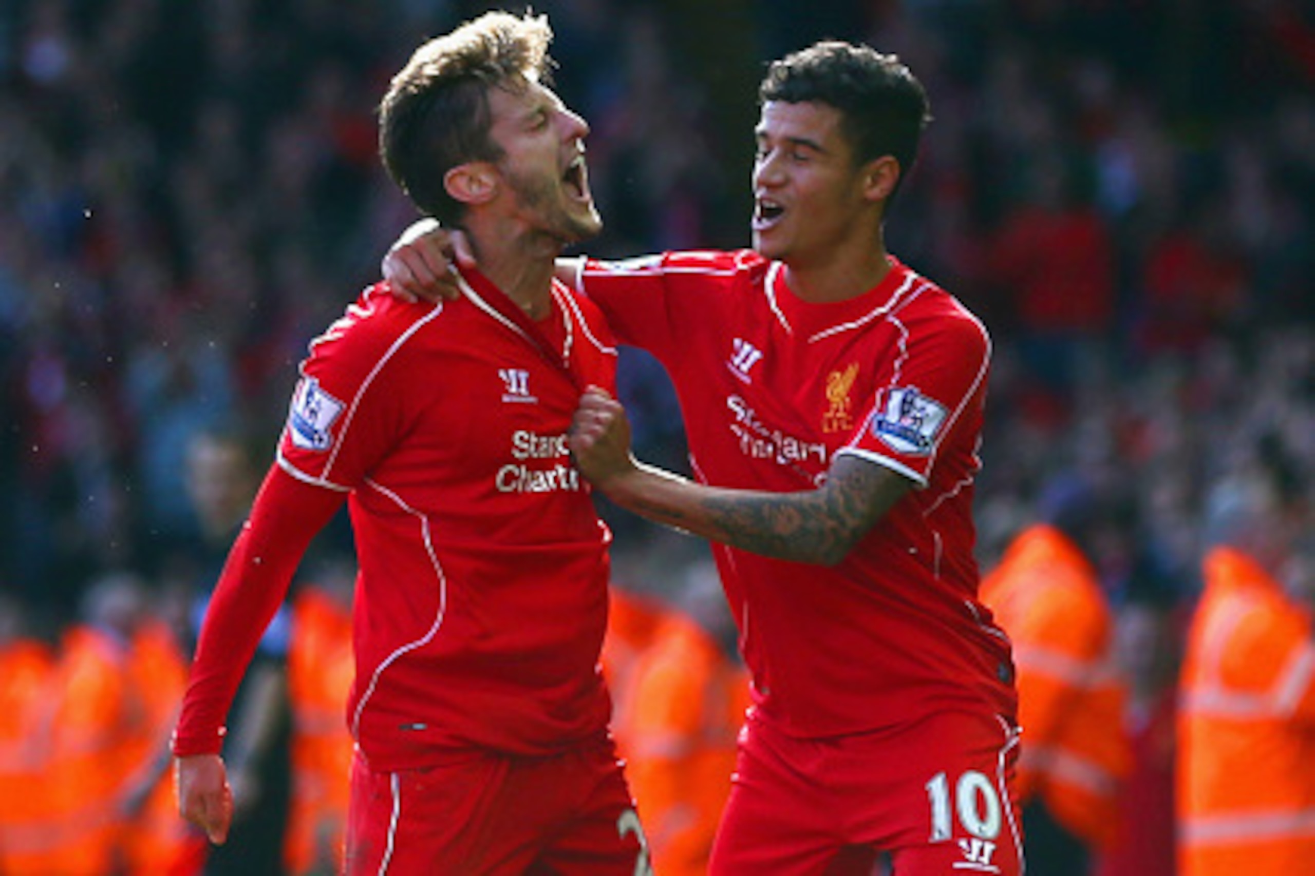 LIVERPOOL, ENGLAND - OCTOBER 04:  Adam Lallana of Liverpool is congratulated by Philippe Coutinho of Liverpool (R) on scoring the opening goal during the Barclays Premier League match between Liverpool and West Bromwich Albion at Anfield on October 4, 201