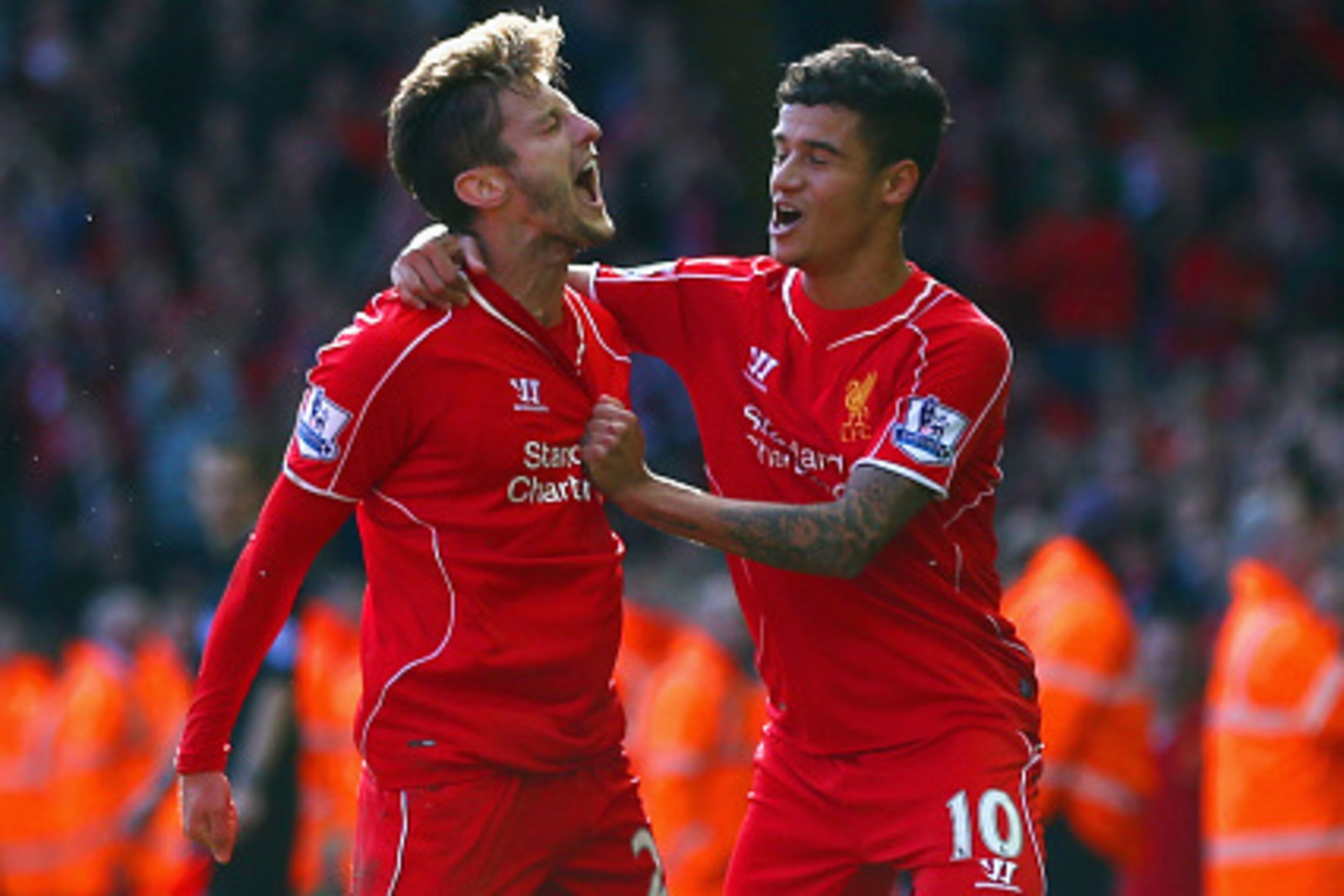 LIVERPOOL, ENGLAND - OCTOBER 04:  Adam Lallana of Liverpool is congratulated by Philippe Coutinho of Liverpool (R) on scoring the opening goal during the Barclays Premier League match between Liverpool and West Bromwich Albion at Anfield on October 4, 201