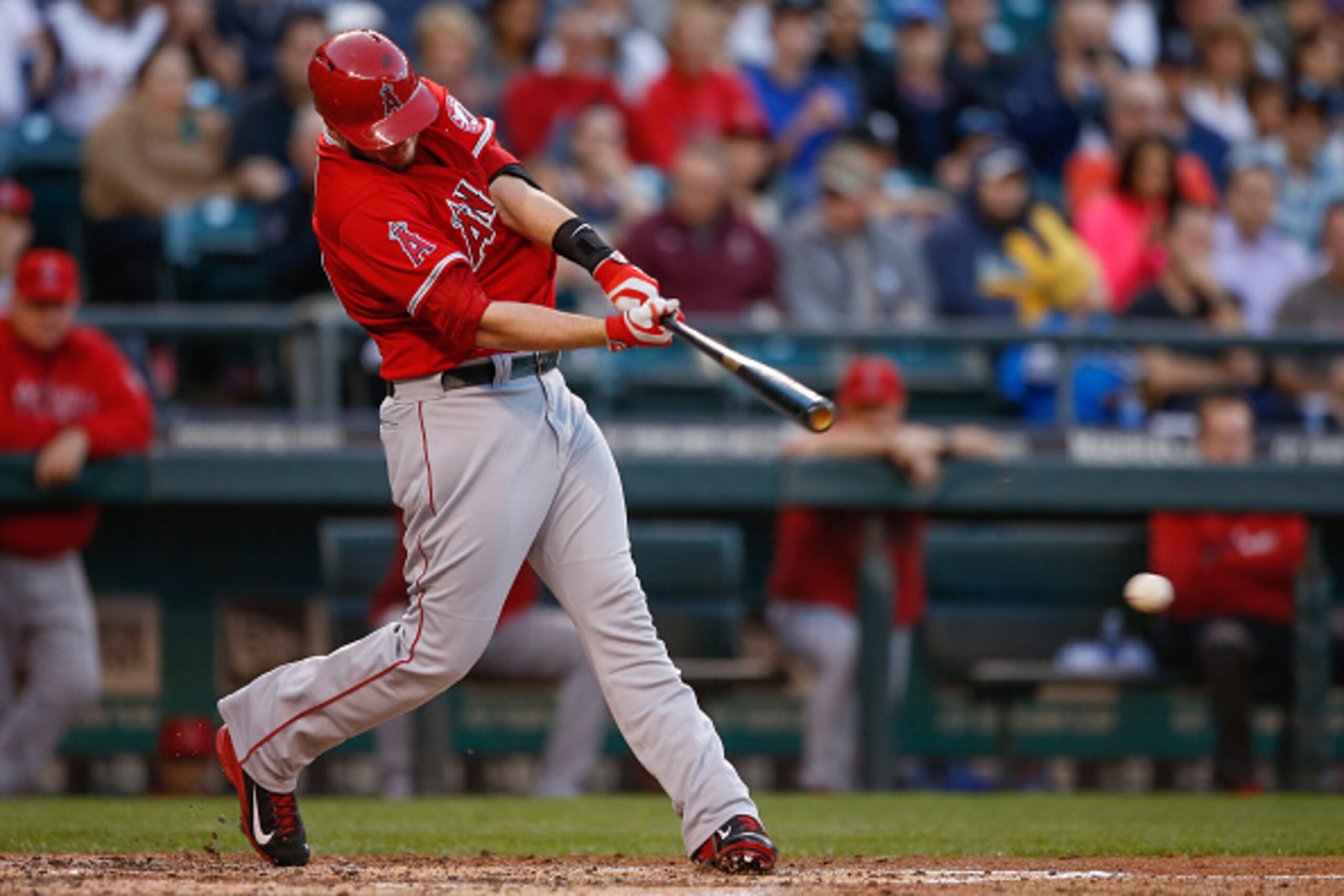 SEATTLE, WA - SEPTEMBER 27:  C.J. Cron #20 of the Los Angeles Angels of Anaheim hits an RBI single in the first inning against the Seattle Mariners at Safeco Field on September 27, 2014 in Seattle, Washington.  (Photo by Otto Greule Jr/Getty Images)