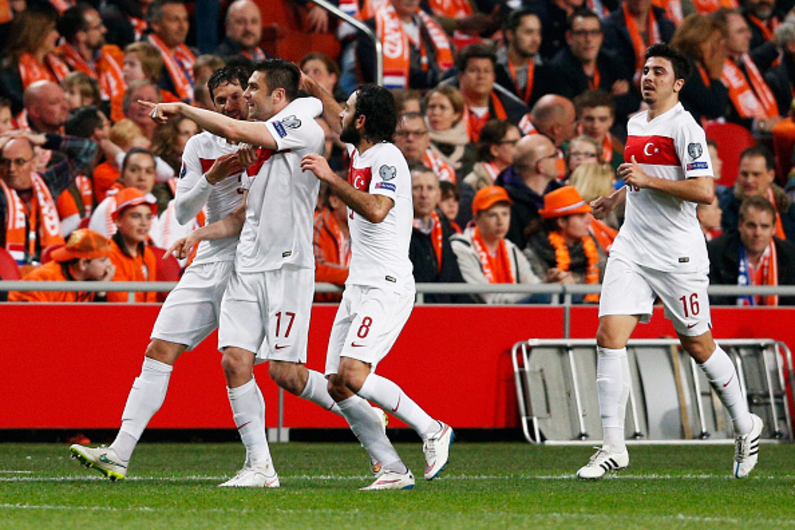 AMSTERDAM, NETHERLANDS - MARCH 28:  Burak Yilmaz #17 of Turkey celebrates with team mates after scoring the first goal of the game during the UEFA EURO 2016 qualifier match bewteen the Netherlands and Turkey held at Amsterdam Arena on March 28, 2015 in Am