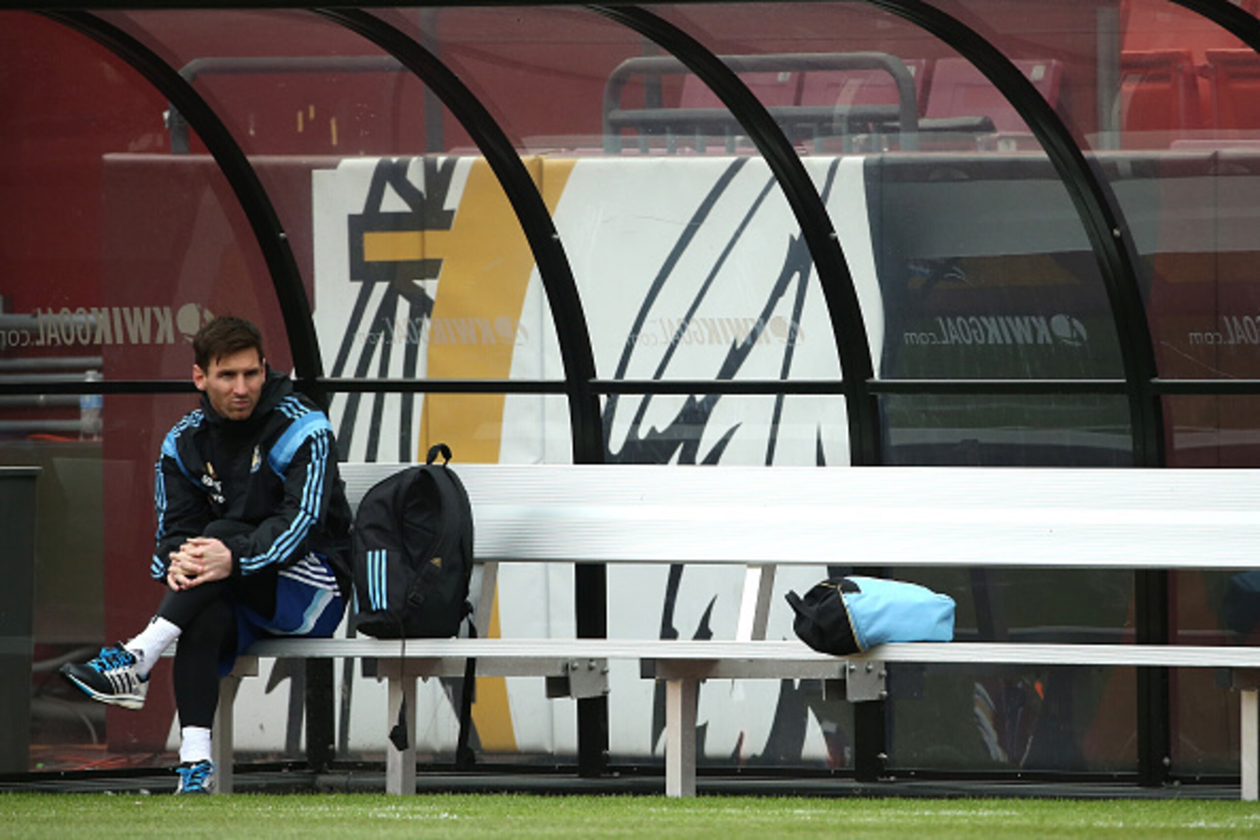 LANDOVER, MD - MARCH 27: Lionel Messi of the Argentinian national soccer team sits on the bench as his teammates practice on the field in preparation to take on El Salvador at FedExField on March 27, 2015 in Landover, Maryland. (Photo by Patrick Smith/Get