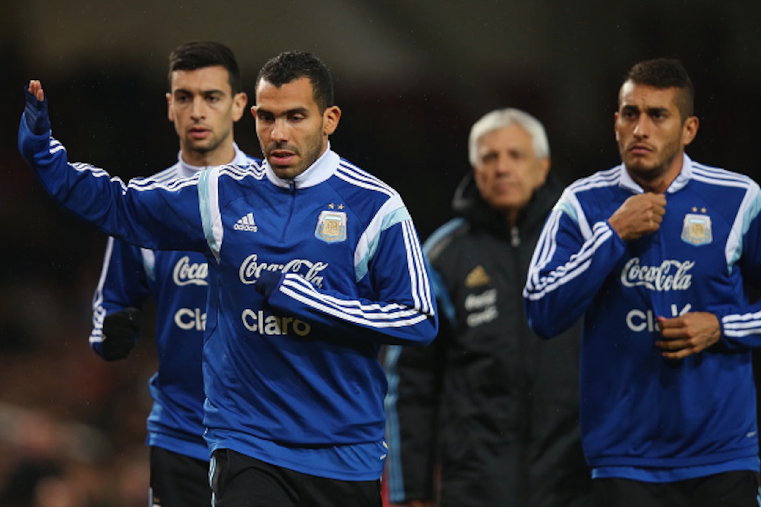 LONDON, ENGLAND - NOVEMBER 12:  Carlos Tevez of Argentina waves to fans as he warms up prior to playing in the second half of the International Friendly between Argentina and Croatia at Boleyn Ground on November 12, 2014 in London, England.  (Photo by Bry