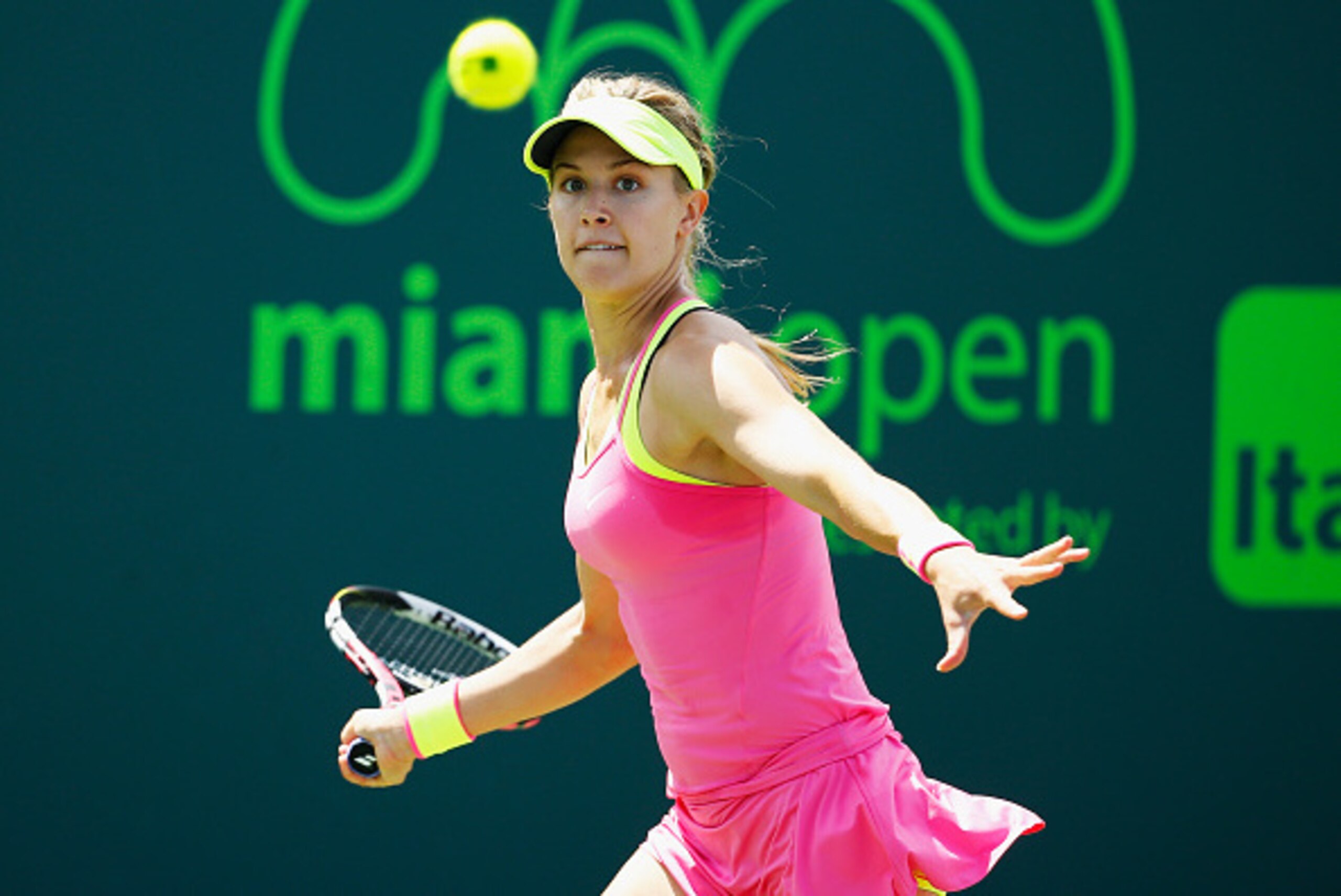 KEY BISCAYNE, FL - MARCH 28:  Eugenie Bouchard of Canada returns the ball to Tatjana Maria of Germany during day 6 of the Miami Open at Crandon Park Tennis Center on March 28, 2015 in Key Biscayne, Florida.  (Photo by Al Bello/Getty Images)