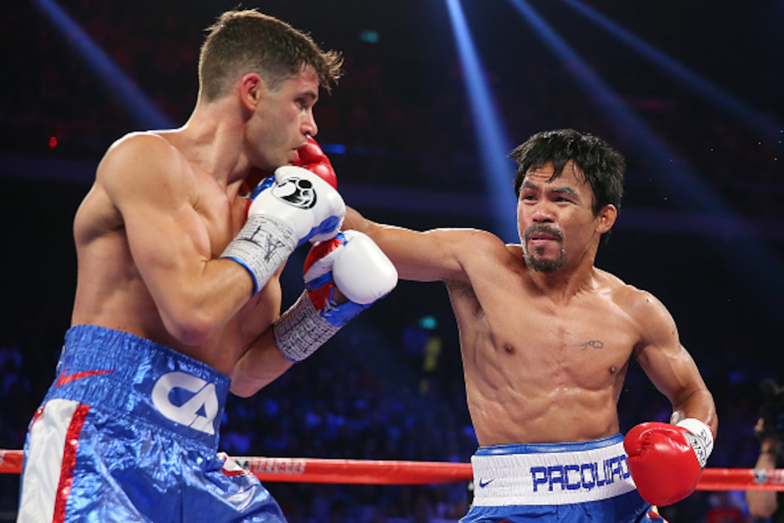 MACAU - NOVEMBER 23:  Manny Pacquiao of the Philippines punches Chris Algieri of the United States during the WBO world welterweight title at The Venetian on November 23, 2014 in Macau, Macau.  (Photo by Chris Hyde/Getty Images)