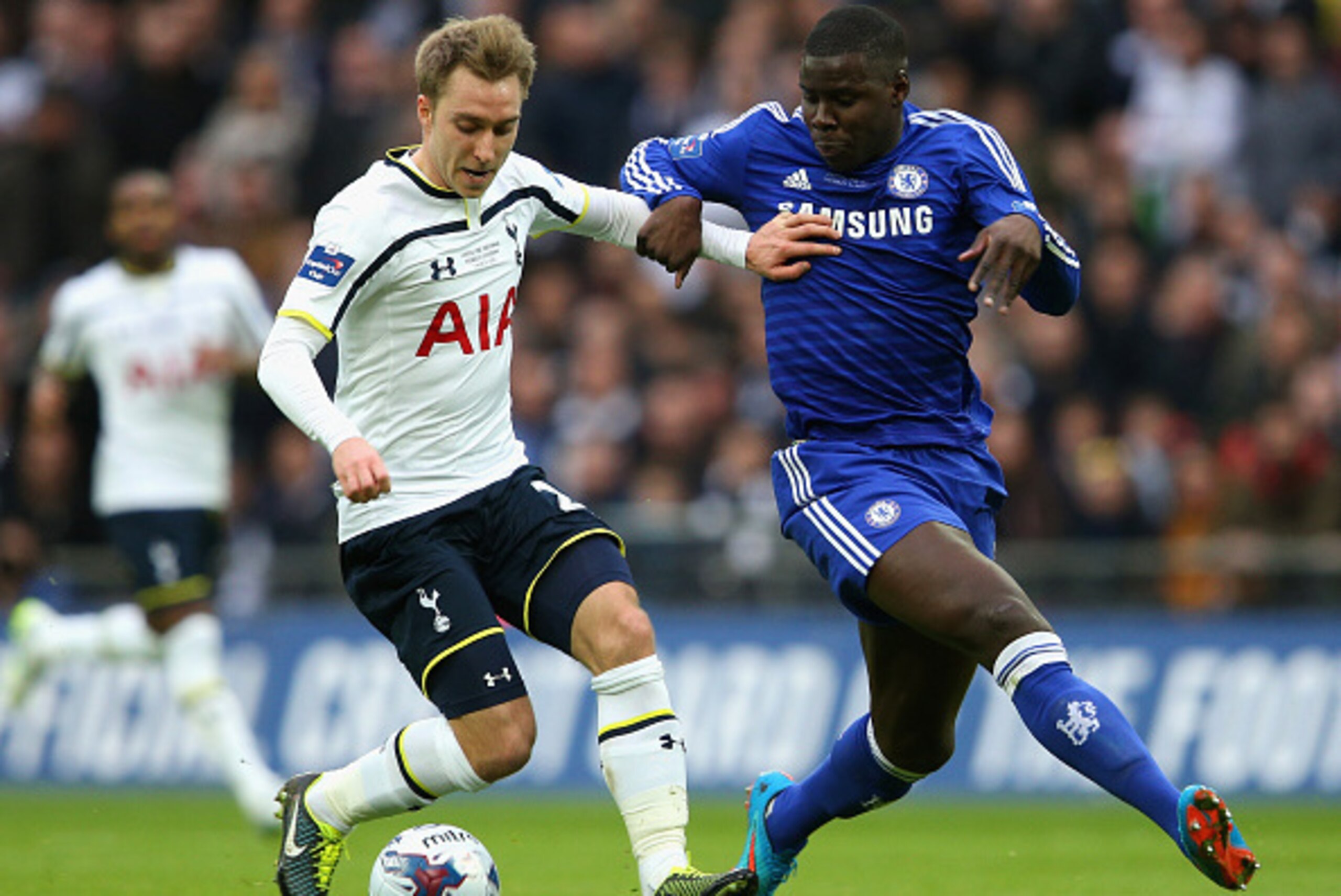 LONDON, ENGLAND - MARCH 01:  Christian Eriksen of Spurs and Kurt Zouma of Chelsea battle for the ball during the Capital One Cup Final match between Chelsea and Tottenham Hotspur at Wembley Stadium on March 1, 2015 in London, England.  (Photo by Clive Mas
