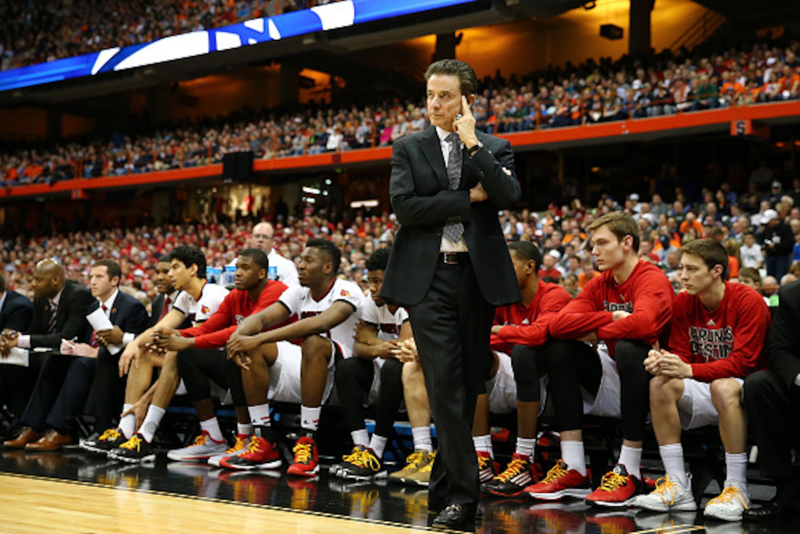 SYRACUSE, NY - MARCH 27:  Head coach Rick Pitino of the Louisville Cardinals reacts in the first half of the game anc during the East Regional Semifinal of the 2015 NCAA Men's Basketball Tournament at the Carrier Dome on March 27, 2015 in Syracuse, New Yo