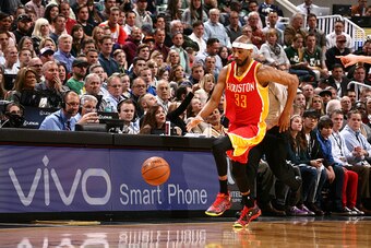 SALT LAKE CITY, UT - MARCH 12:  Corey Brewer #33 of the Houston Rockets brings the ball up court against the Utah Jazz on March 12, 2015 at EnergySolutions Arena in Salt Lake City, Utah. NOTE TO USER: User expressly acknowledges and agrees that, by downlo