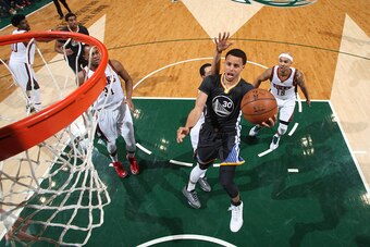 MILWAUKEE, WI - MARCH 28: Stephen Curry #30 of the Golden State Warriors goes up for a shot against the Milwaukee Bucks on March 28, 2015 at BMO Harris Bradley Center in Milwaukee, Wisconsin. NOTE TO USER: User expressly acknowledges and agrees that, by d