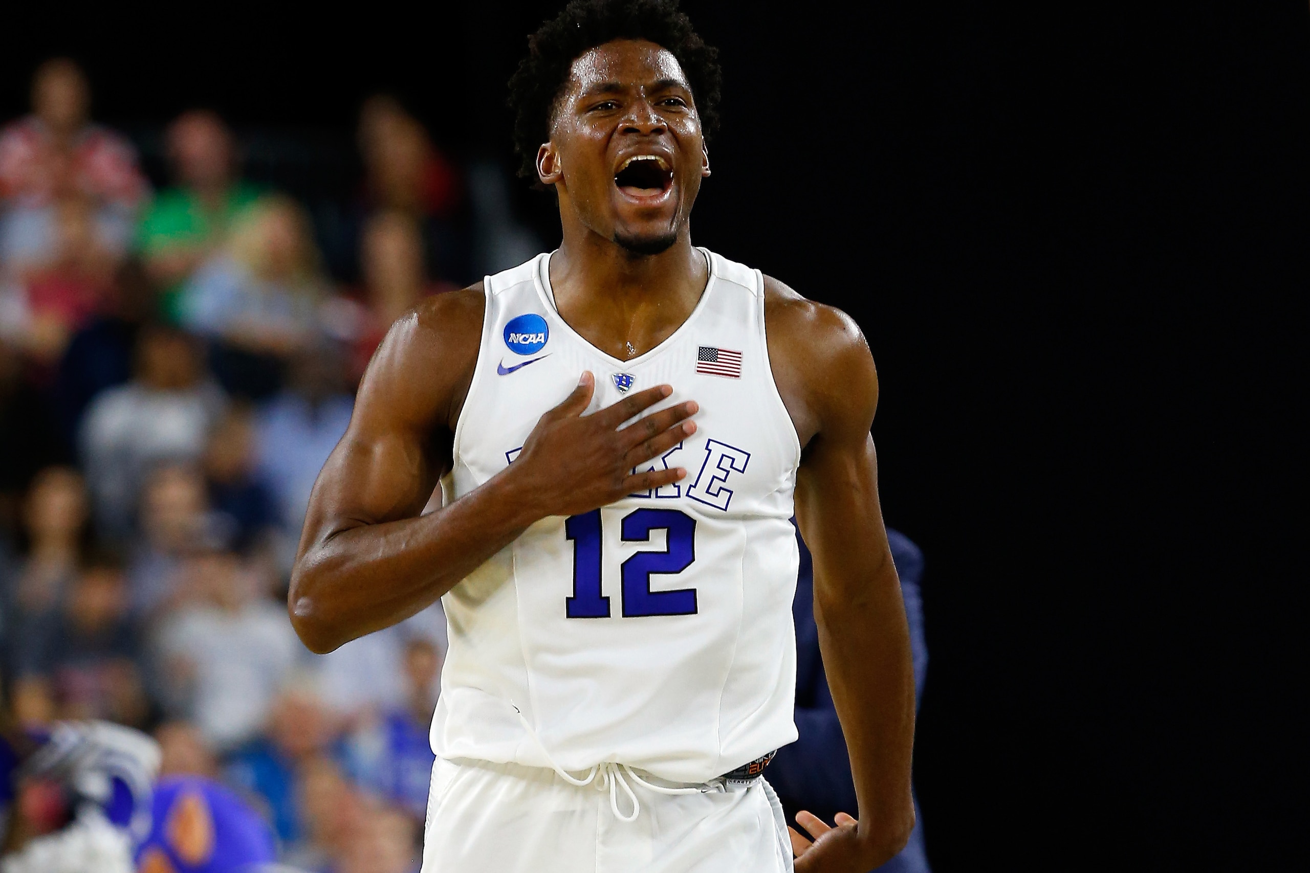 HOUSTON, TX - MARCH 27:  Justise Winslow #12 of the Duke Blue Devils reacts against the Utah Utes during a South Regional Semifinal game of the 2015 NCAA Men's Basketball Tournament at NRG Stadium on March 27, 2015 in Houston, Texas.  (Photo by Tom Pennin