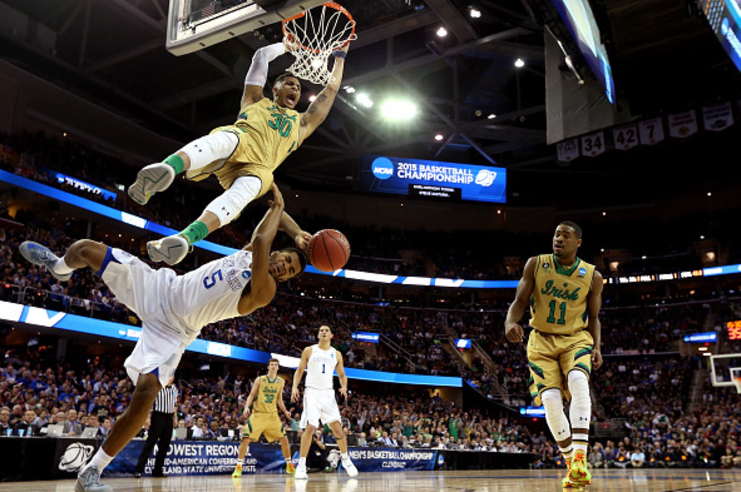CLEVELAND, OH - MARCH 28:  Zach Auguste #30 of the Notre Dame Fighting Irish dunks over Andrew Harrison #5 of the Kentucky Wildcats in the second half during the Midwest Regional Final of the 2015 NCAA Men's Basketball tournament at Quicken Loans Arena on