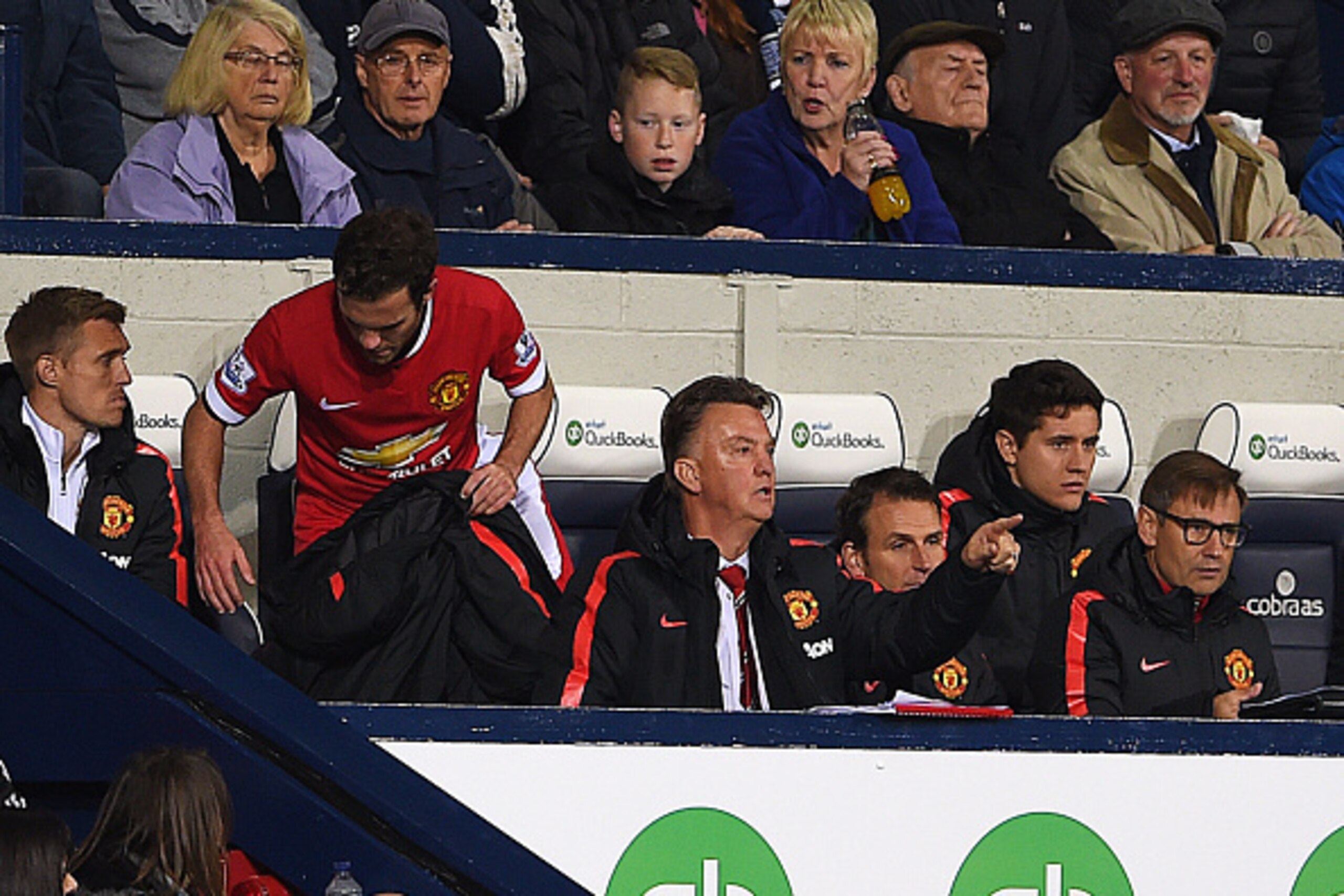 WEST BROMWICH, ENGLAND - OCTOBER 20:  Louis van Gaal manager of Manchester United signals from the bench as he susbstitutes Juan Mata (2L) during the Barclays Premier League match between West Bromwich Albion and Manchester United at The Hawthorns on Octo