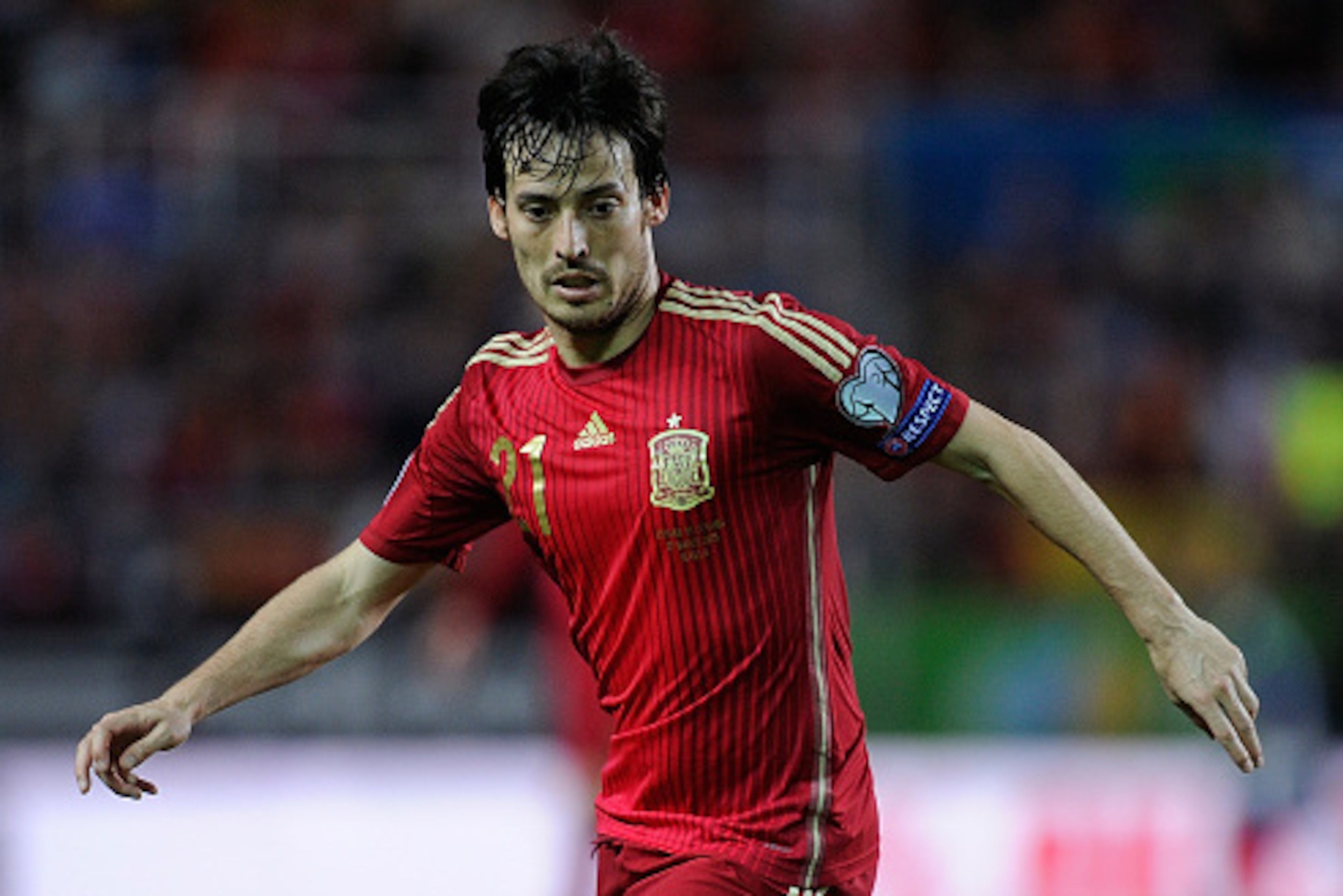 SEVILLE, SPAIN - MARCH 27: David Silva of Spain controls the ball during the Spain v Ukraine EURO 2016 Qualifier at Estadio Ramon Sanchez Pizjuan stadium on March 27, 2015 in Seville, Spain. (Photo by Denis Doyle/Getty Images) SEVILLE, SPAIN - MARCH 27: David Silva of Spain controls the ball during the Spain v Ukraine EURO 2016 Qualifier at Estadio Ramon Sanchez Pizjuan stadium on March 27, 2015 in Seville, Spain. (Photo by Denis Doyle/Getty Images)