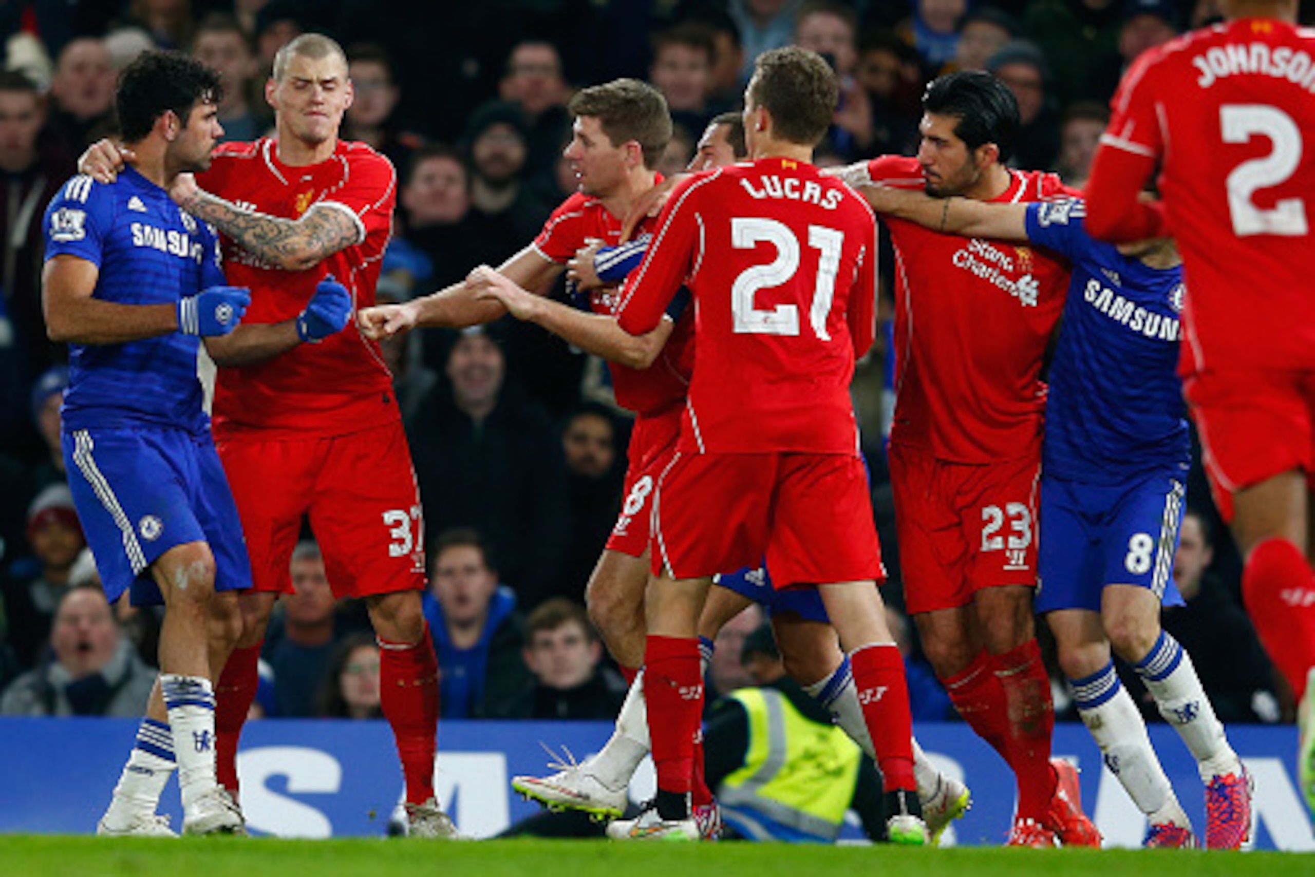 LONDON, ENGLAND - JANUARY 27:  Martin Skrtel of Liverpool (L) holds back Diego Costa of Chelsea as  he clashes with Steven Gerrard of Liverpool during the Capital One Cup Semi-Final second leg between Chelsea and Liverpool at Stamford Bridge on January 27