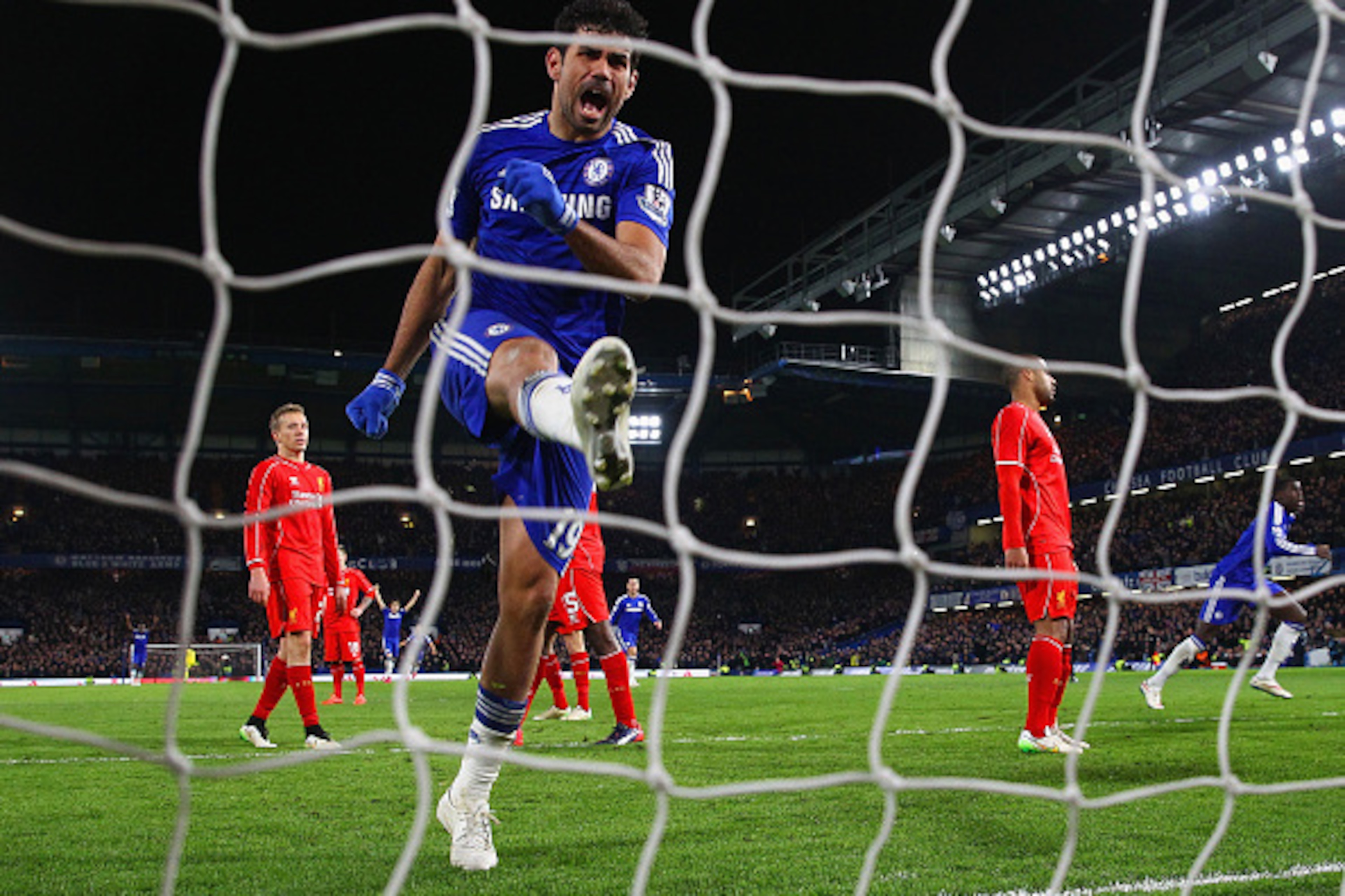 LONDON, ENGLAND - JANUARY 27:  Diego Costa of Chelse celebrates after Branislav Ivanovic of Chelsea scored the opening goal during the Capital One Cup Semi-Final second leg between Chelsea and Liverpool at Stamford Bridge on January 27, 2015 in London, En