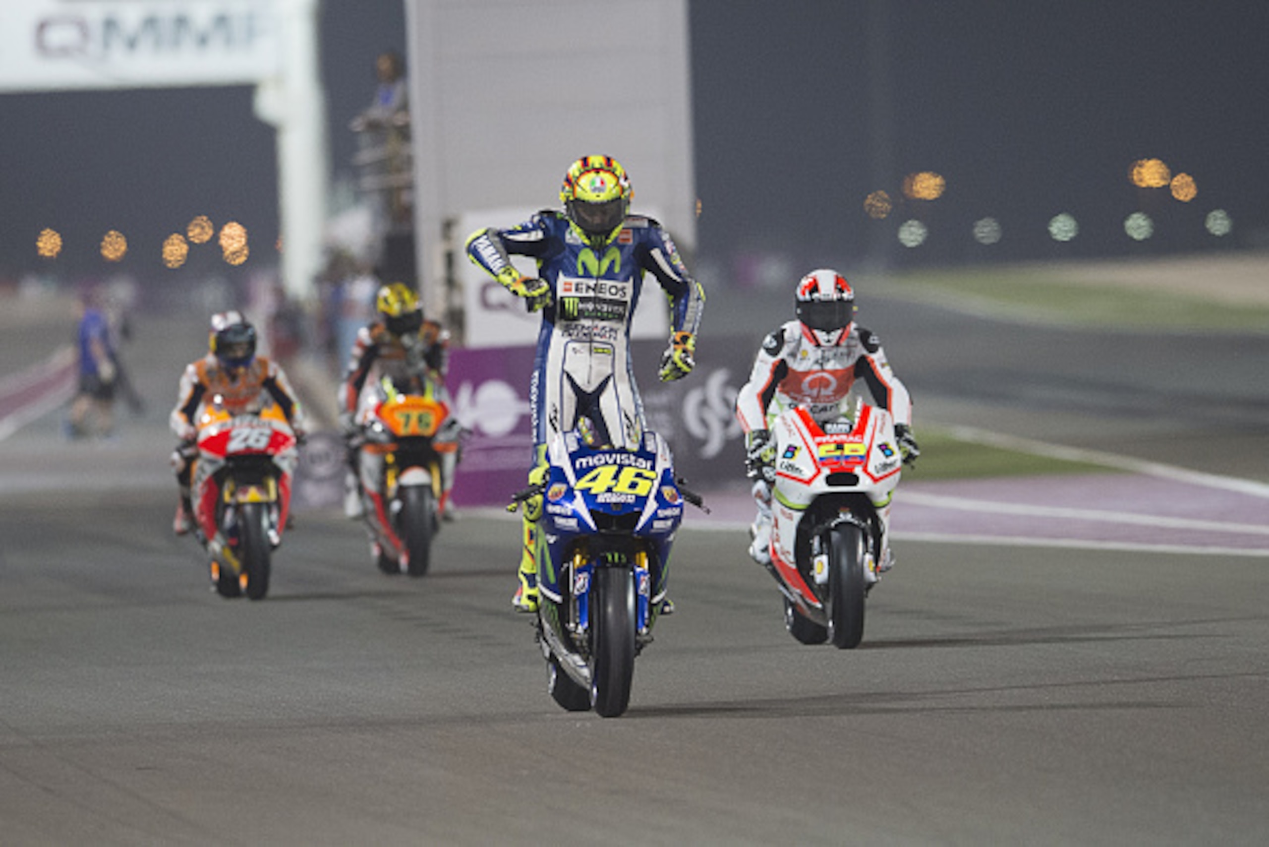DOHA, QATAR - MARCH 26:  Valentino Rossi of Italy and Movistar Yamaha MotoGP starts from box during the MotoGp of Qatar - Free Practice at Losail Circuit on March 26, 2015 in Doha, Qatar.  (Photo by Mirco Lazzari gp/Getty Images)
