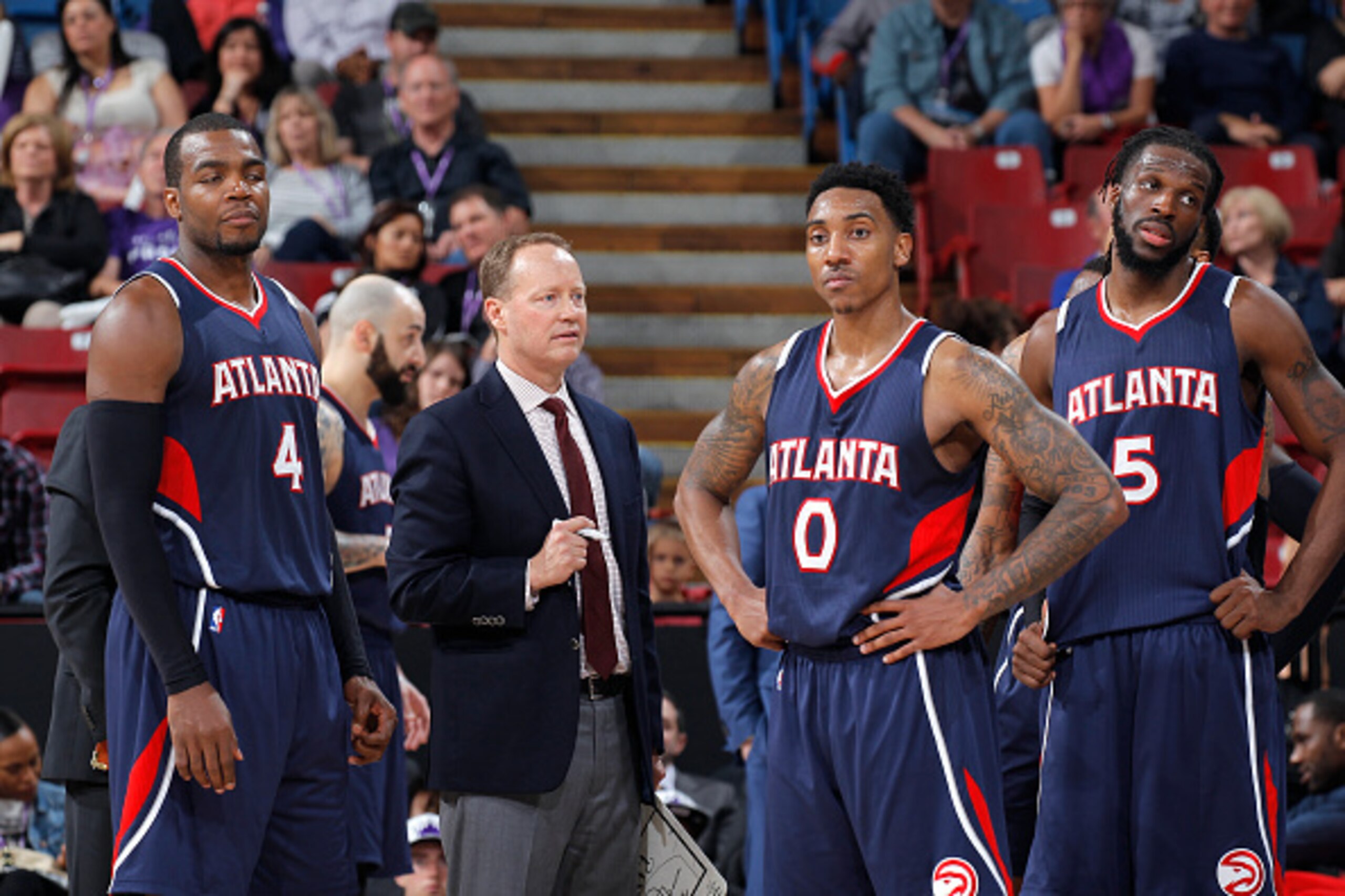 SACRAMENTO, CA - MARCH 16: Head coach Mike Budenholzer of the Atlanta Hawks coaches Paul Millsap #4 and Jeff Teague #0 against the Sacramento Kings on March 16, 2015 at Sleep Train Arena in Sacramento, California. NOTE TO USER: User expressly acknowledges