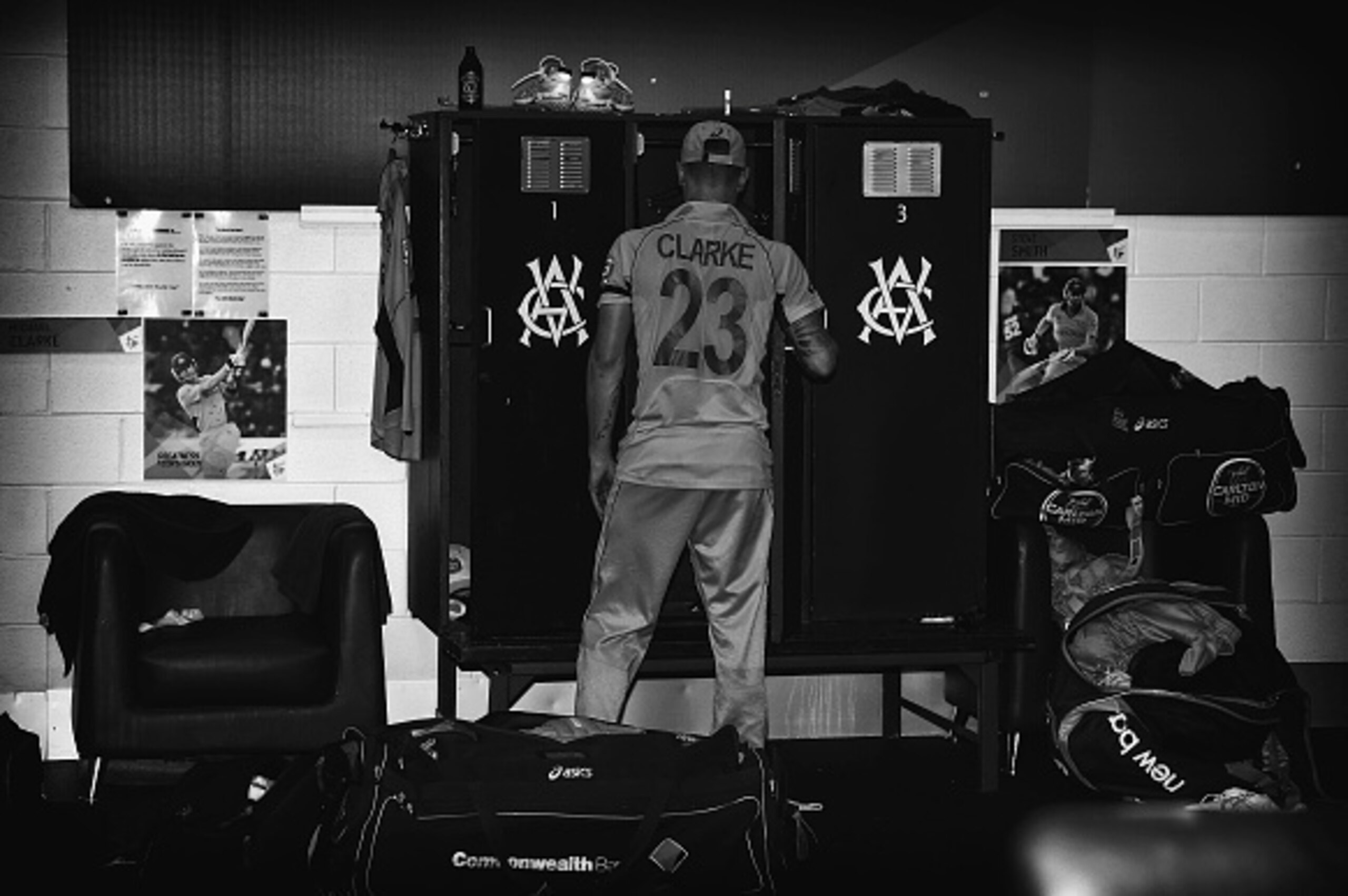 MELBOURNE, AUSTRALIA - MARCH 29:  (EDITORS NOTE: This image has been converted to black and white) Michael Clarke of Australia packs up his gear in the change rooms after the 2015 ICC Cricket World Cup final match between Australia and New Zealand at Melb