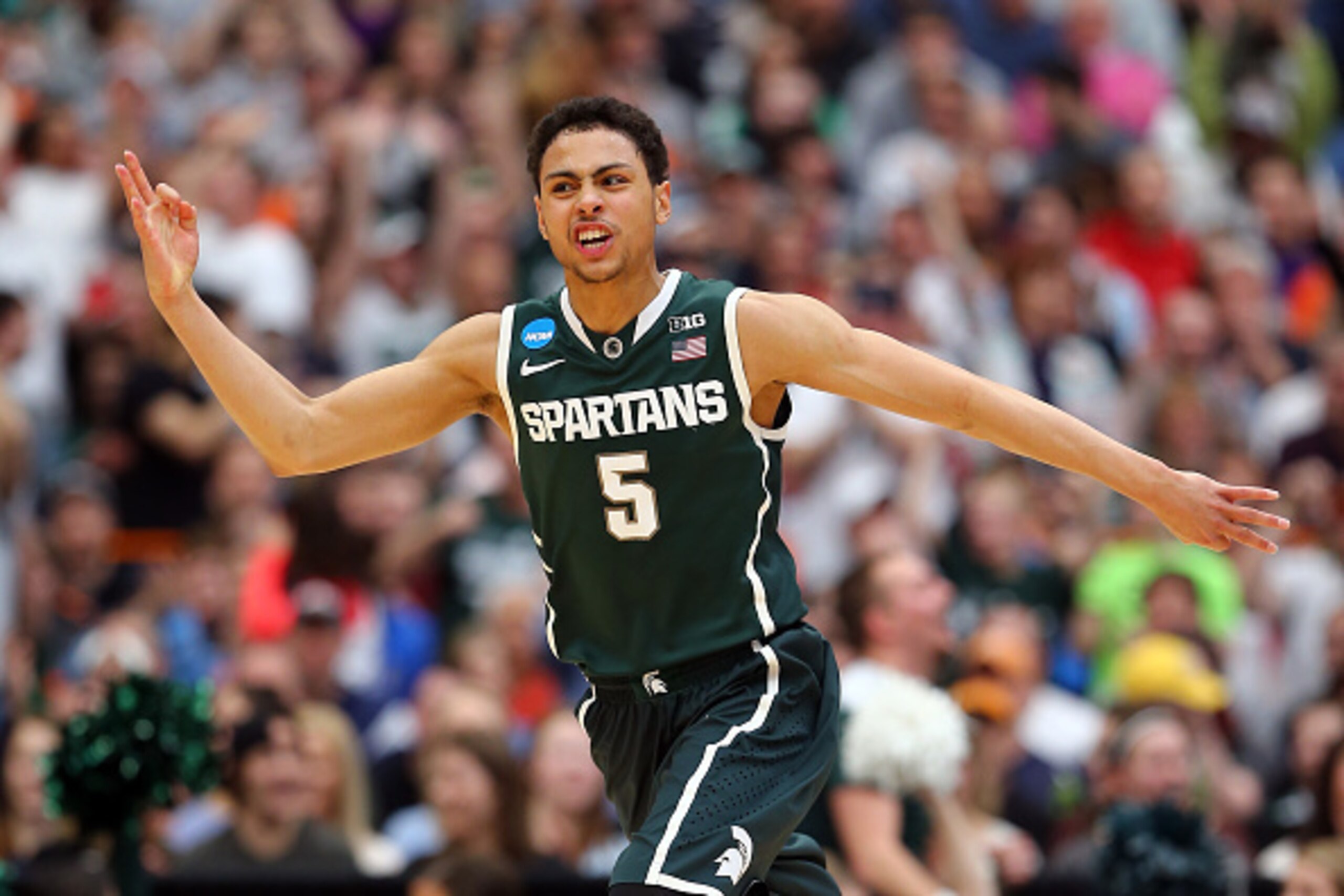 SYRACUSE, NY - MARCH 29: Bryn Forbes #5 of the Michigan State Spartans reacts to a three pointer in the second half of the game against the Louisville Cardinals during the East Regional Final of the 2015 NCAA Men's Basketball Tournament at Carrier Dome o SYRACUSE, NY - MARCH 29: Bryn Forbes #5 of the Michigan State Spartans reacts to a three pointer in the second half of the game against the Louisville Cardinals during the East Regional Final of the 2015 NCAA Men's Basketball Tournament at Carrier Dome o